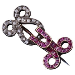 Broche ancienne en or 12ct avec rubis et diamants
