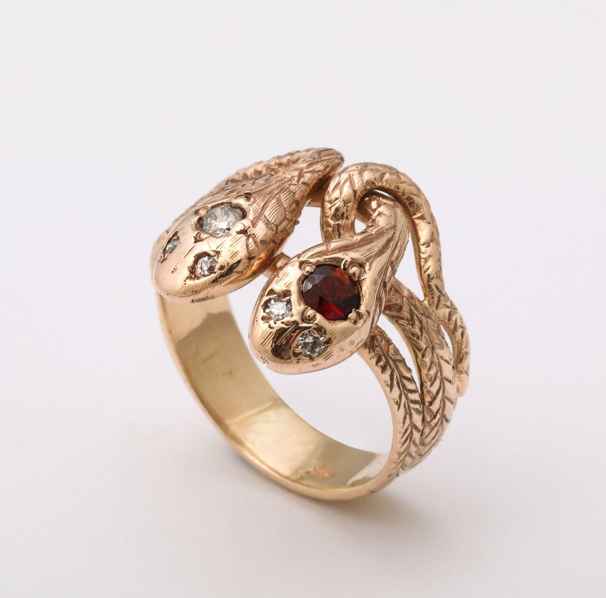 Antique Ruby and Diamond Double Snake Gold Ring. A pair of 14 k Gold intertwining snakes wrap around the finger one diamond head and one ruby head, with diamond eyes. The ring, for 'The Year of The Snake'. Size 6.5 can be modified to fit.