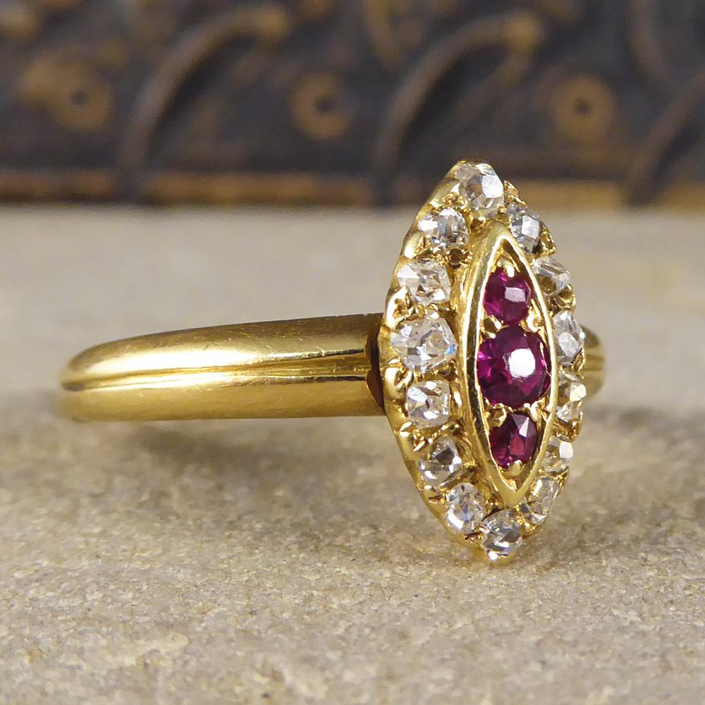 This Victorian ring features three rubies surrounded by fourteen glistening diamonds in a marquise design. Modeled in 18ct Gold it looks pretty and dainty on the finger!

Ring Size: UK N 1/2 or US 7 

Condition: Very Good, slightest signs of wear