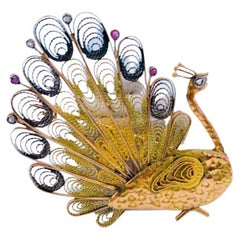Broche paon ancienne en or avec rubis et diamants