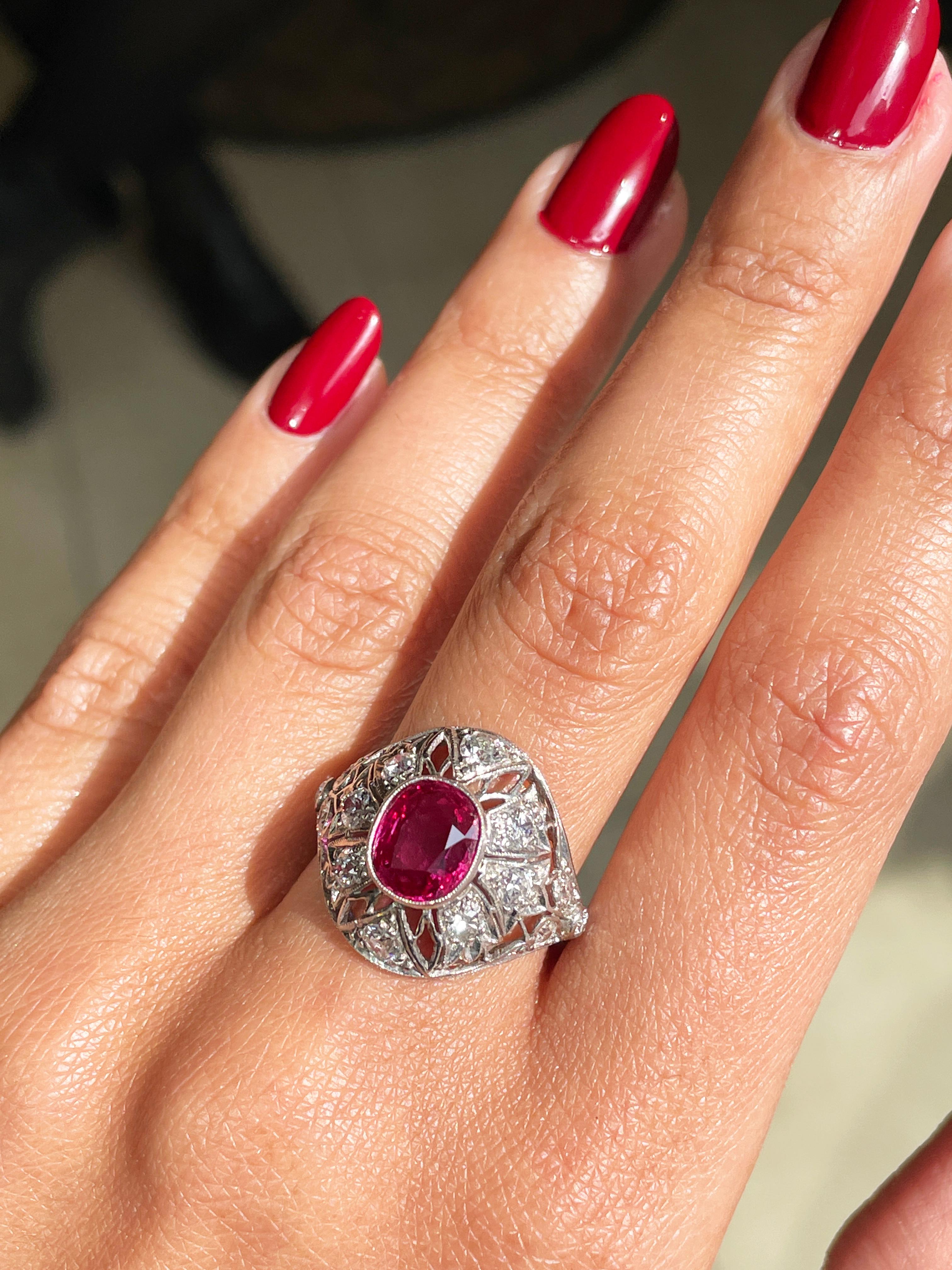 Oval Cut Antique Ruby and Diamond Platinum Dome Cluster Cocktail Ring, Circa 1920's For Sale