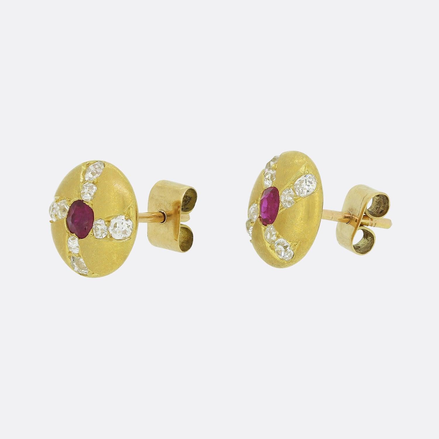 This is a lovely pair of antique ruby and diamond stud earrings. Each earring features a central ruby surrounded by 8 perfectly matched old cut diamonds. The diamonds are set in pairs and the earrings have a wonderful matte finish.

Condition: Used