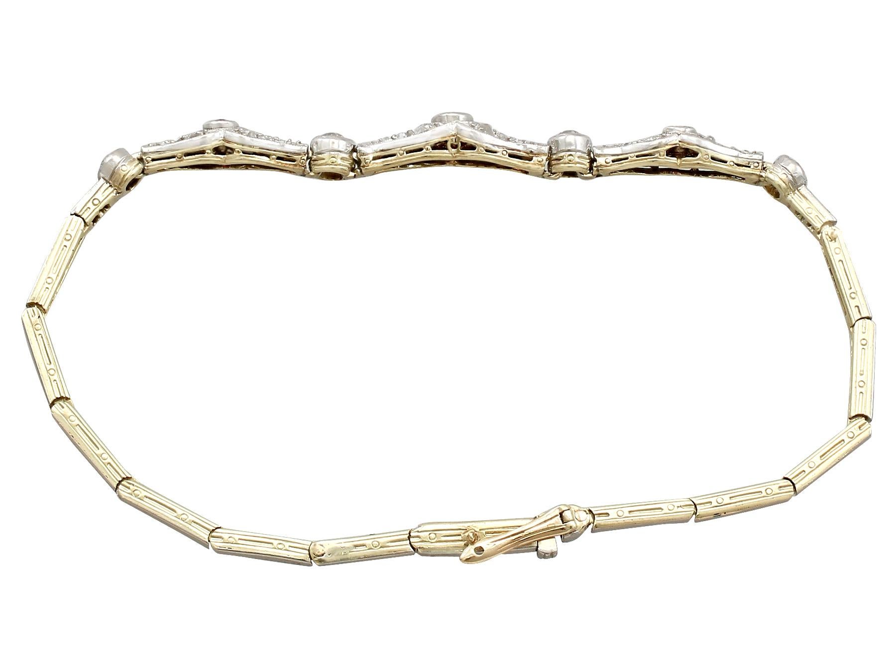 An impressive antique 1900s 0.18 carat ruby and 0.52 carat diamond, 15 karat yellow gold and platinum set bracelet; part of our diverse antique jewelry and estate jewelry collections.

This fine and impressive antique ruby bracelet has been crafted