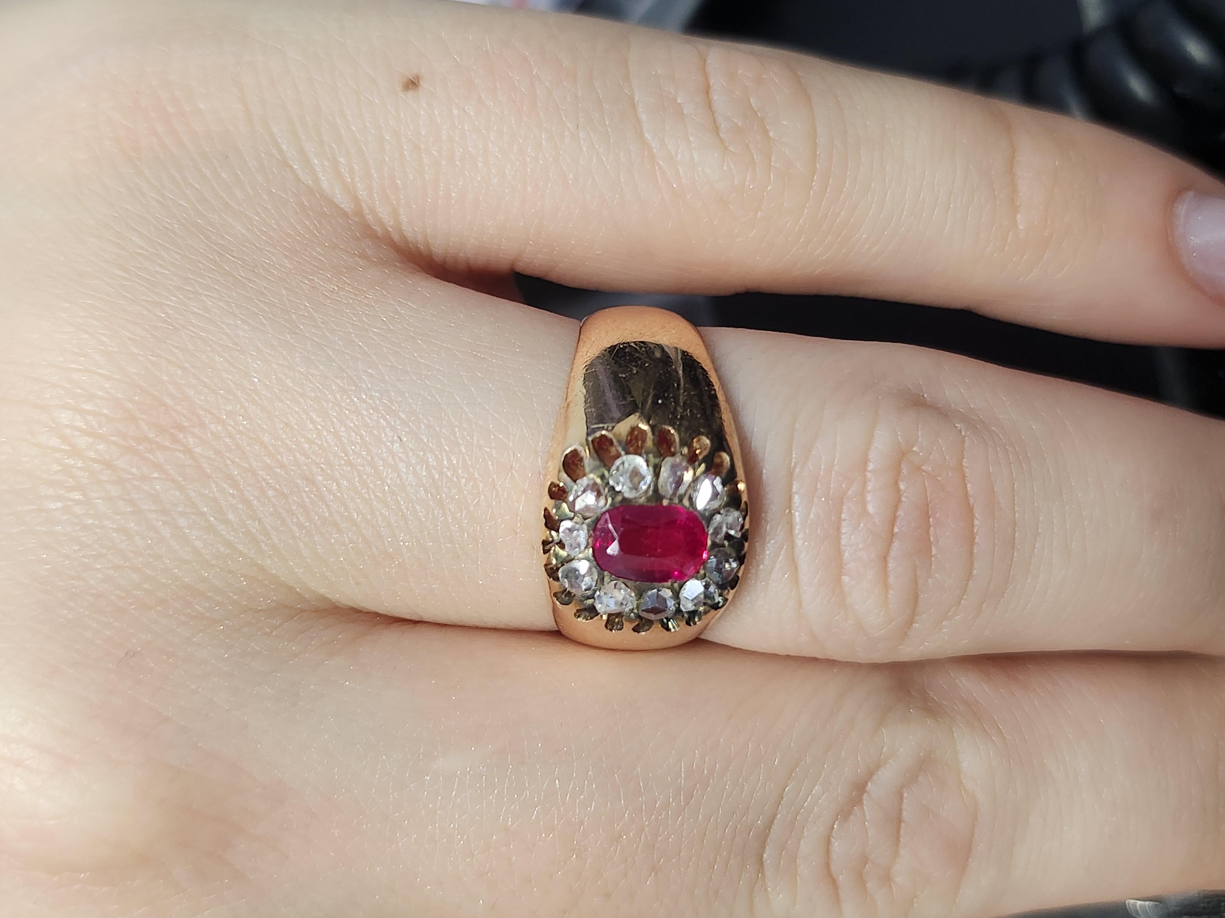 Antique 14k heavy rose gold colour ring centeted with 1 oval ruby stone flanked with rose cut diamonds in fine prongs ring is hall markes 56 gold standard and initial maker mark in cyrllic alphabet