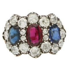 Antique Ruby, Blue Sapphire and Old Cut Diamond Triple Cluster Ring