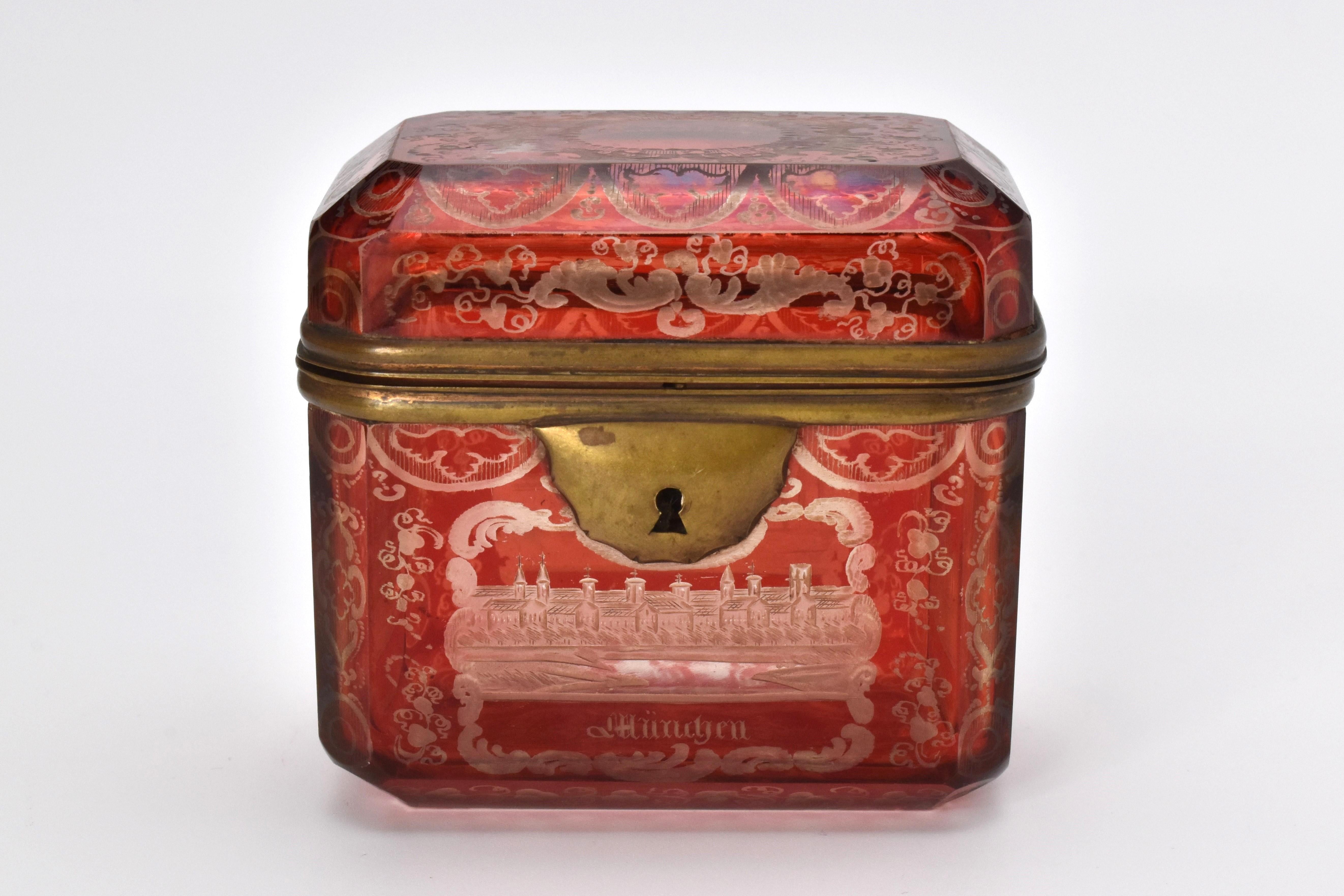 Jewelry casket, with rectangular shape and hinged metal mounts, finely engraved all around with buildings and scrollwork, all four side panels have engrave work and inscriptions, the top and bottom with further engraving decorations.

Bohemia, circa