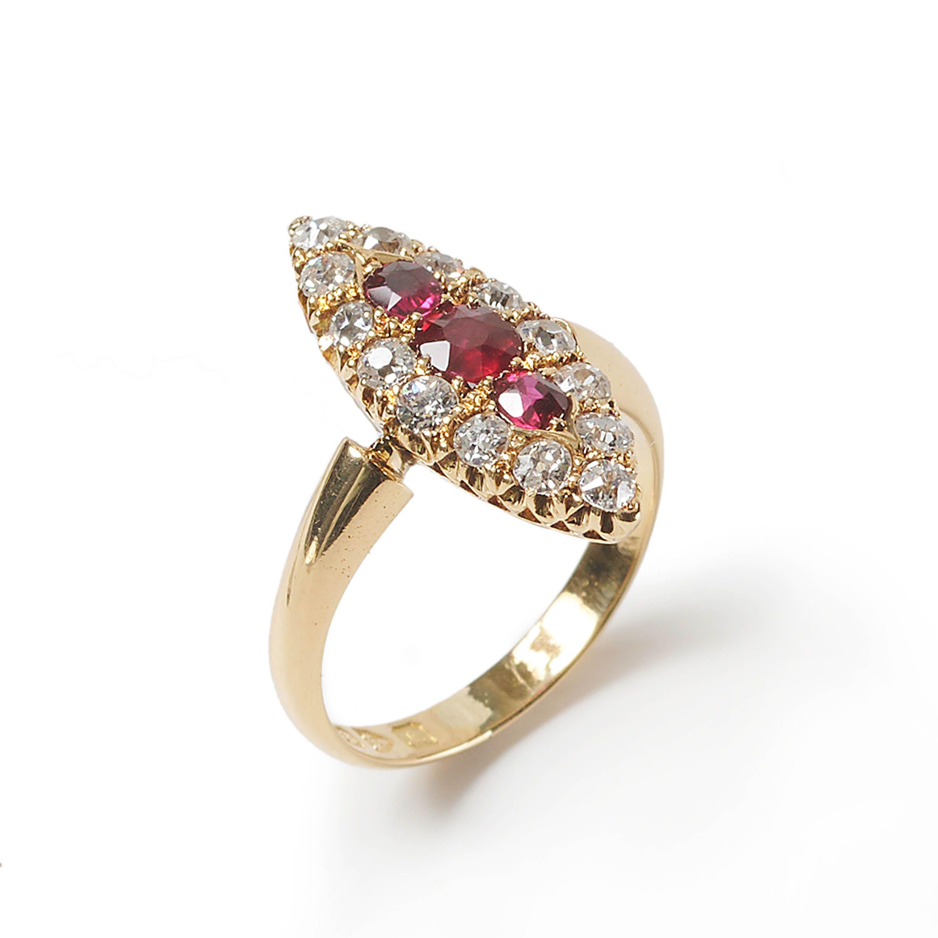 A Victorian ruby, diamond and gold navette shaped cluster ring, with a cushion shaped faceted ruby, in the centre of two oval rubies, surrounded by fourteen old-cut diamonds, in a claw set navette shaped cluster, with a pierced crown gallery, onto a