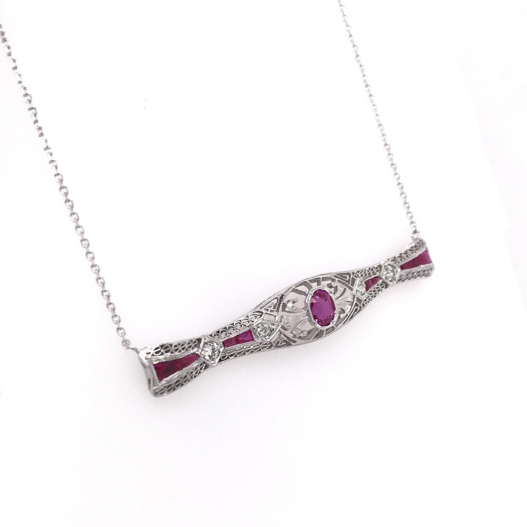 This piece is an antique revision made from reclaimed antique materials. This necklace was originally an antique bar pin (brooch) handcrafted sometime during the Art Deco design period ( 1920-1940 ). The platinum bar pin features a central antique