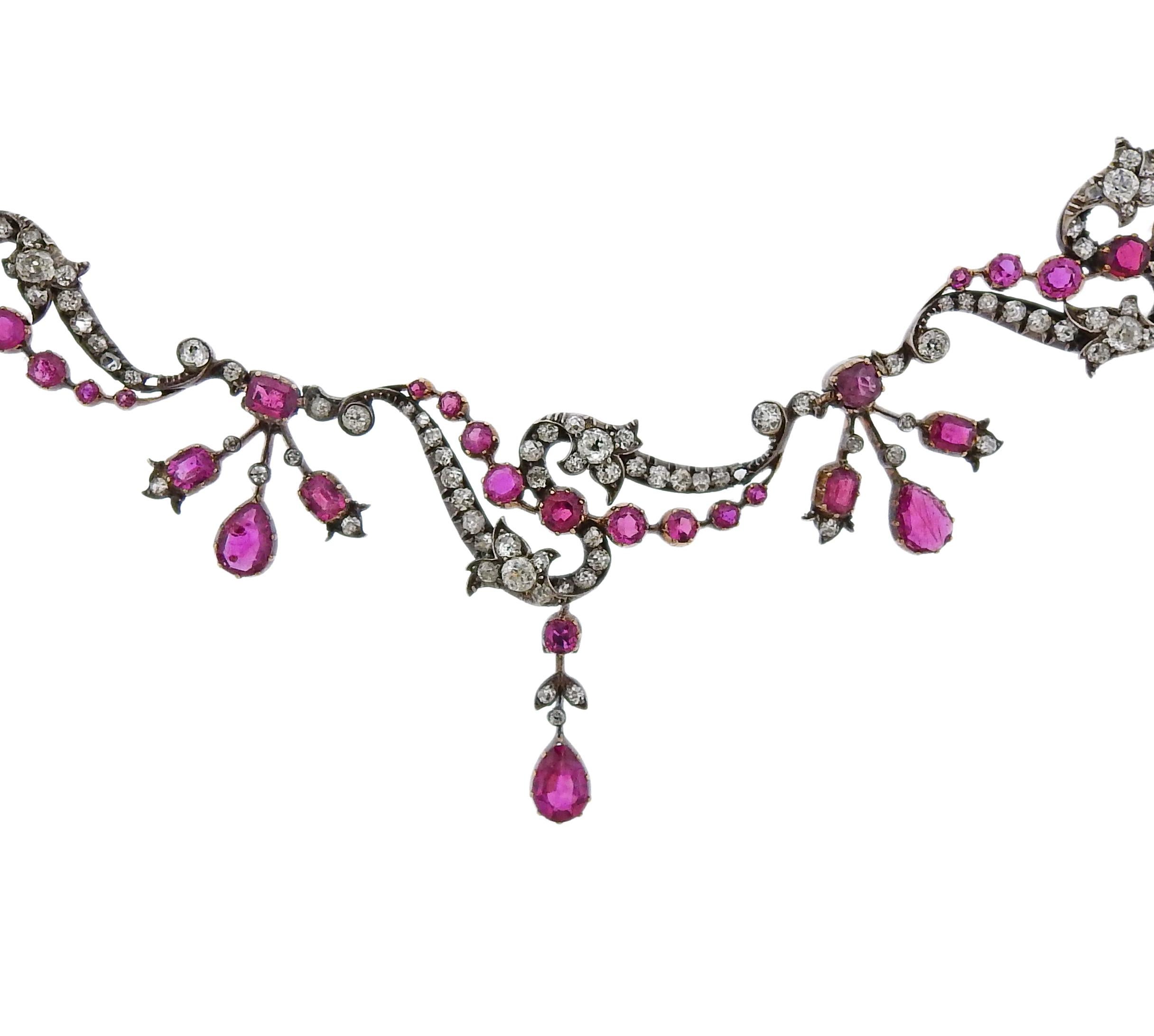 14k gold and silver antique necklace , set with rubies and approx. 0.80ctw in diamonds. Necklace is 14