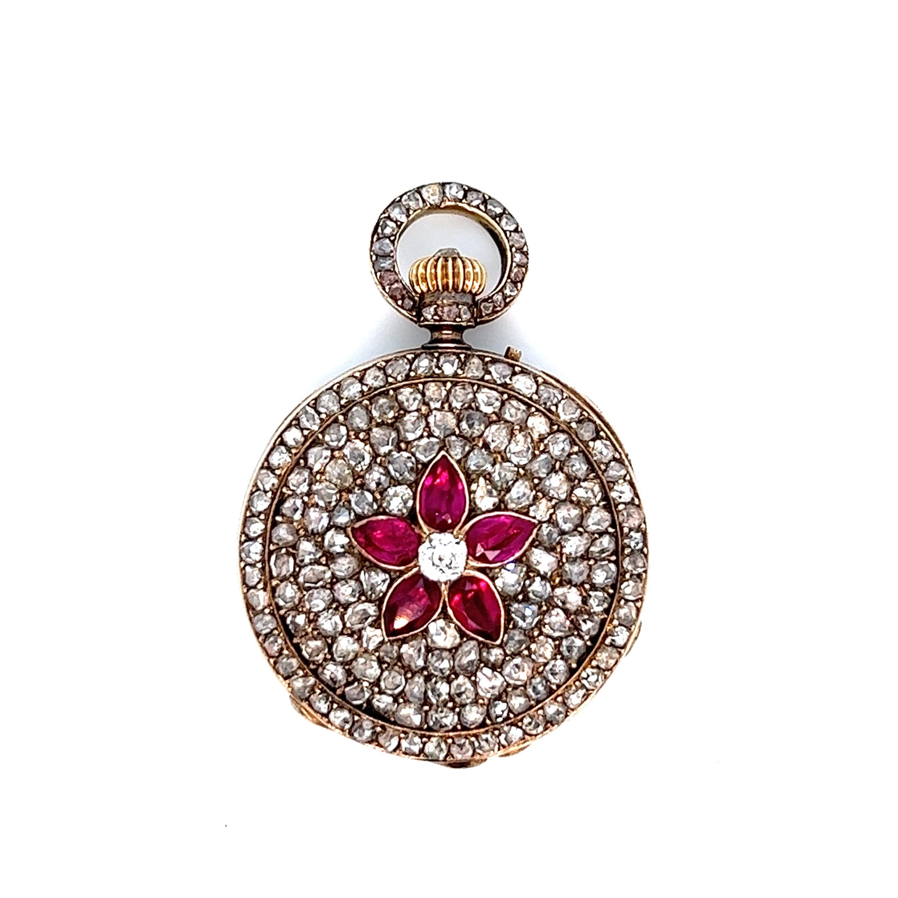 Antique circular pendant watch, circa 1880s

Tear drop-shaped rubies surrounded by rose-cut diamonds; center stone is a diamond of approximately 0.10 carat

Marked: Geneve, No. 86891 

Dimensions: width 1 inch, length 1 inch
Total weight: 22.8 grams