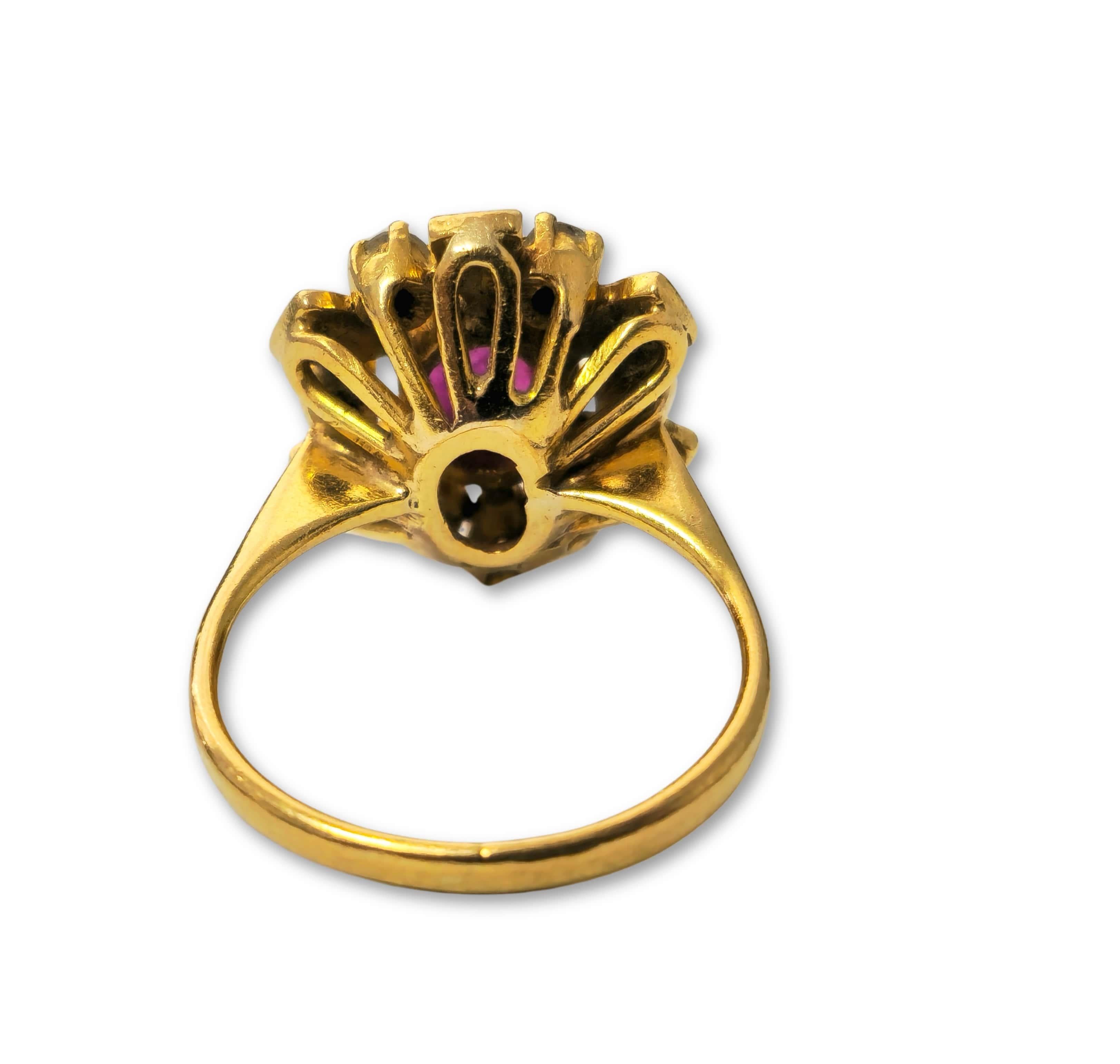 Presenting a luxurious 18k yellow gold ring adorned with a captivating 1.30 carat oval ruby, exuding natural beauty from the earth's depths. Accompanied by 0.45 carats of single-cut diamonds with SI2 clarity and G color, this exquisite piece weighs