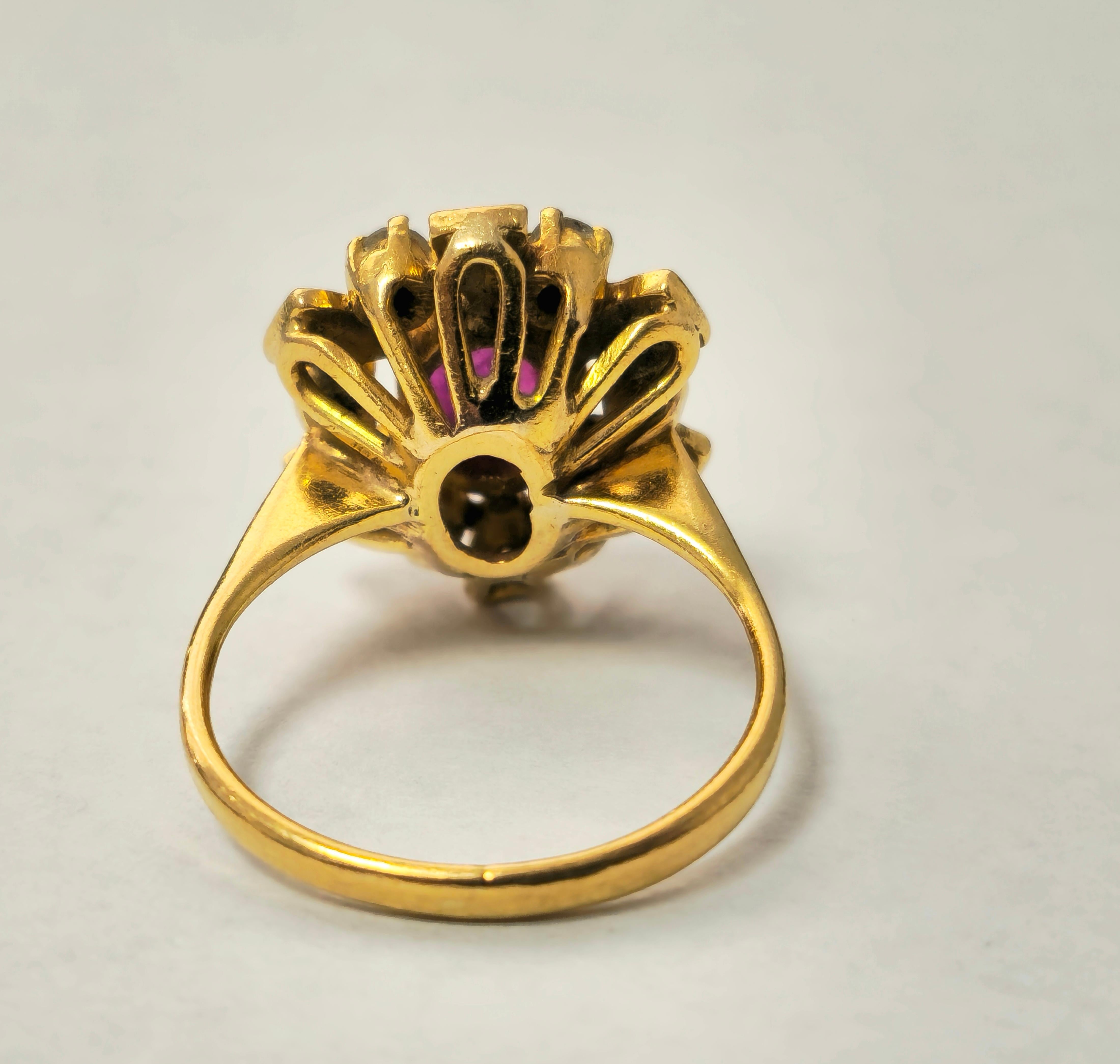 Presenting a luxurious 18k yellow gold ring adorned with a captivating 1.30 carat oval ruby, exuding natural beauty from the earth's depths. Accompanied by 0.45 carats of single-cut diamonds with SI2 clarity and G color, this exquisite piece weighs