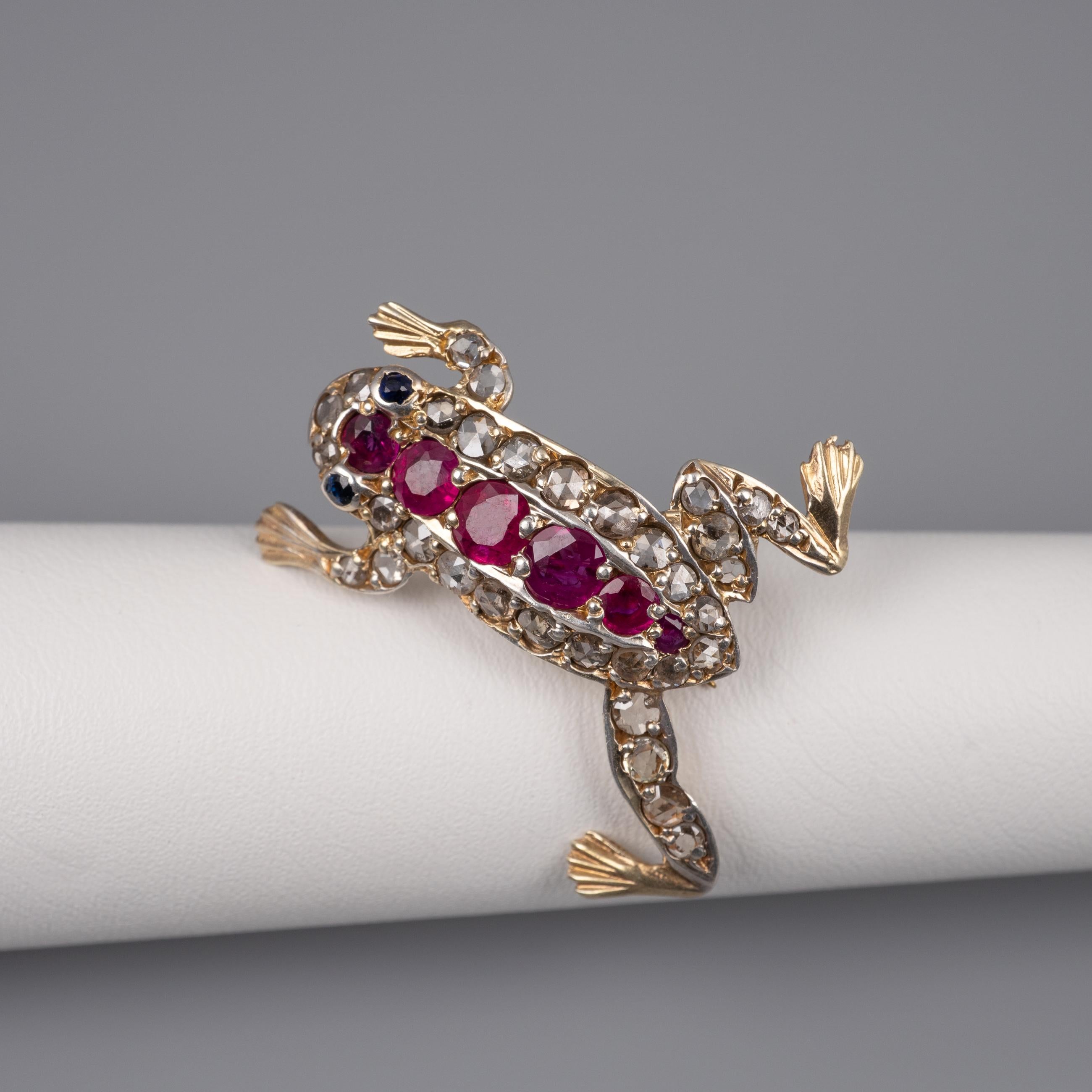 The most adorable antique Art Deco 14-carat gold Frog brooch decorated with old rose cut diamonds totaling 0.90 carats, a stripe of natural rubies totaling 0.70 carats and little sapphire eyes. You need this in your frog collection!

The gold pin is