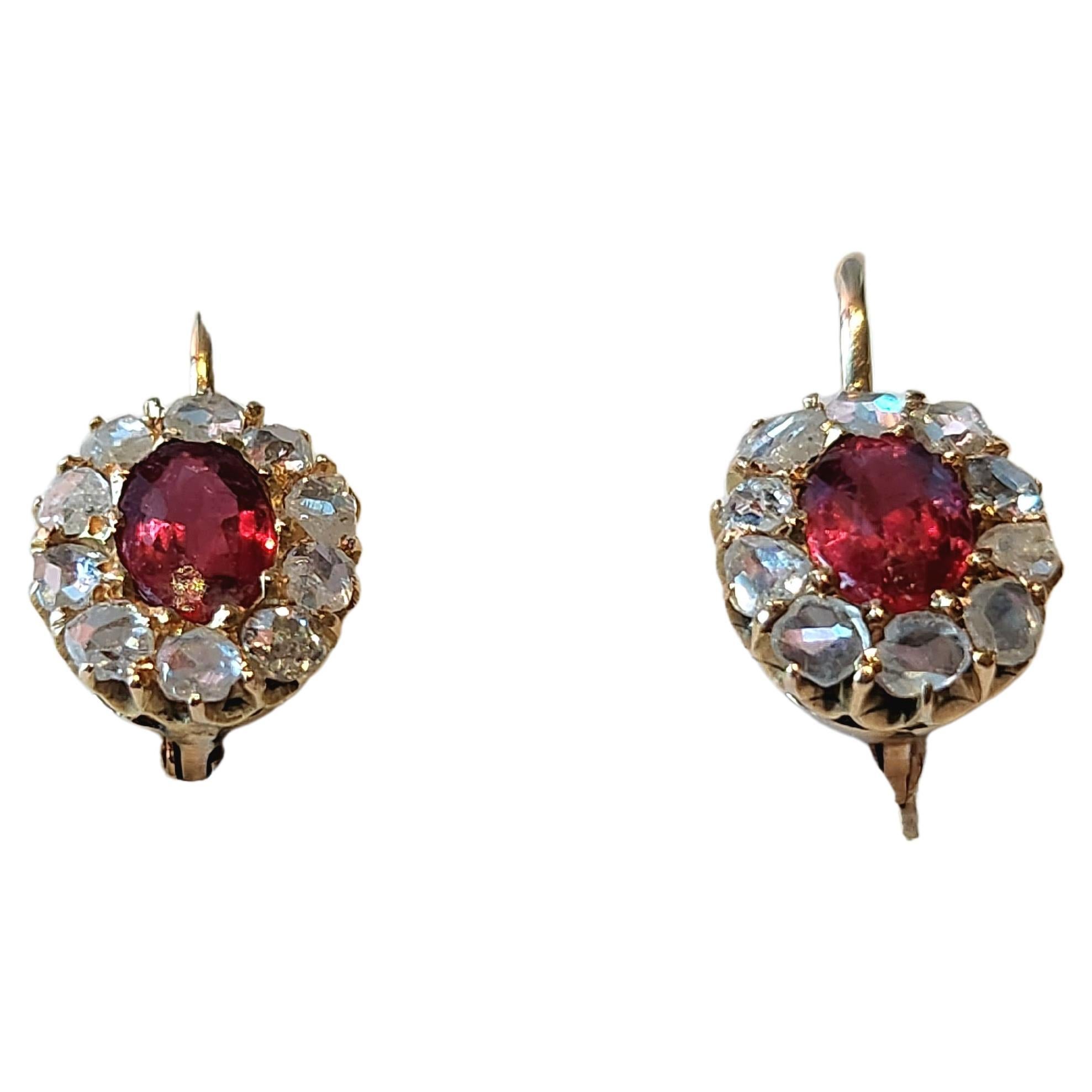 Antique imperial russian era 1907.c earrings centered with a ruby spinel blood color flanked with rose cut diamonds earrings head diameter 4mm×4.5mm and 1.5cm lenght earrings was made in odessa 1907.c hall marked 56 imperial russian gold standard