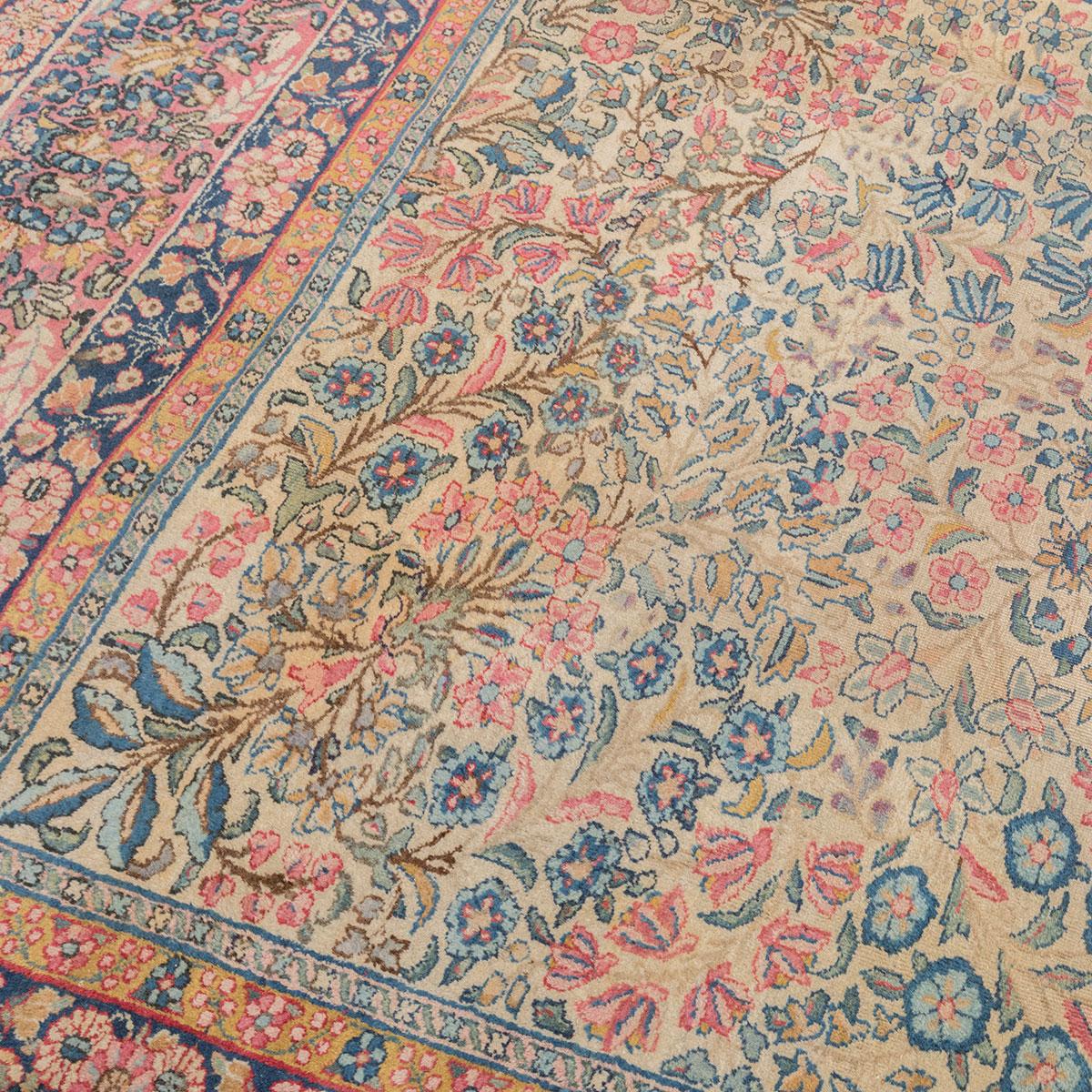 Antique rug. Classic design of the city of Kirman elaborated for the European market of the time. 
- Handmade wool Rug.
- Rug has measures: 3.65 x 2.70 m.
- A succession of flowers in different ranges make up the central field.
- Blues, pinks and