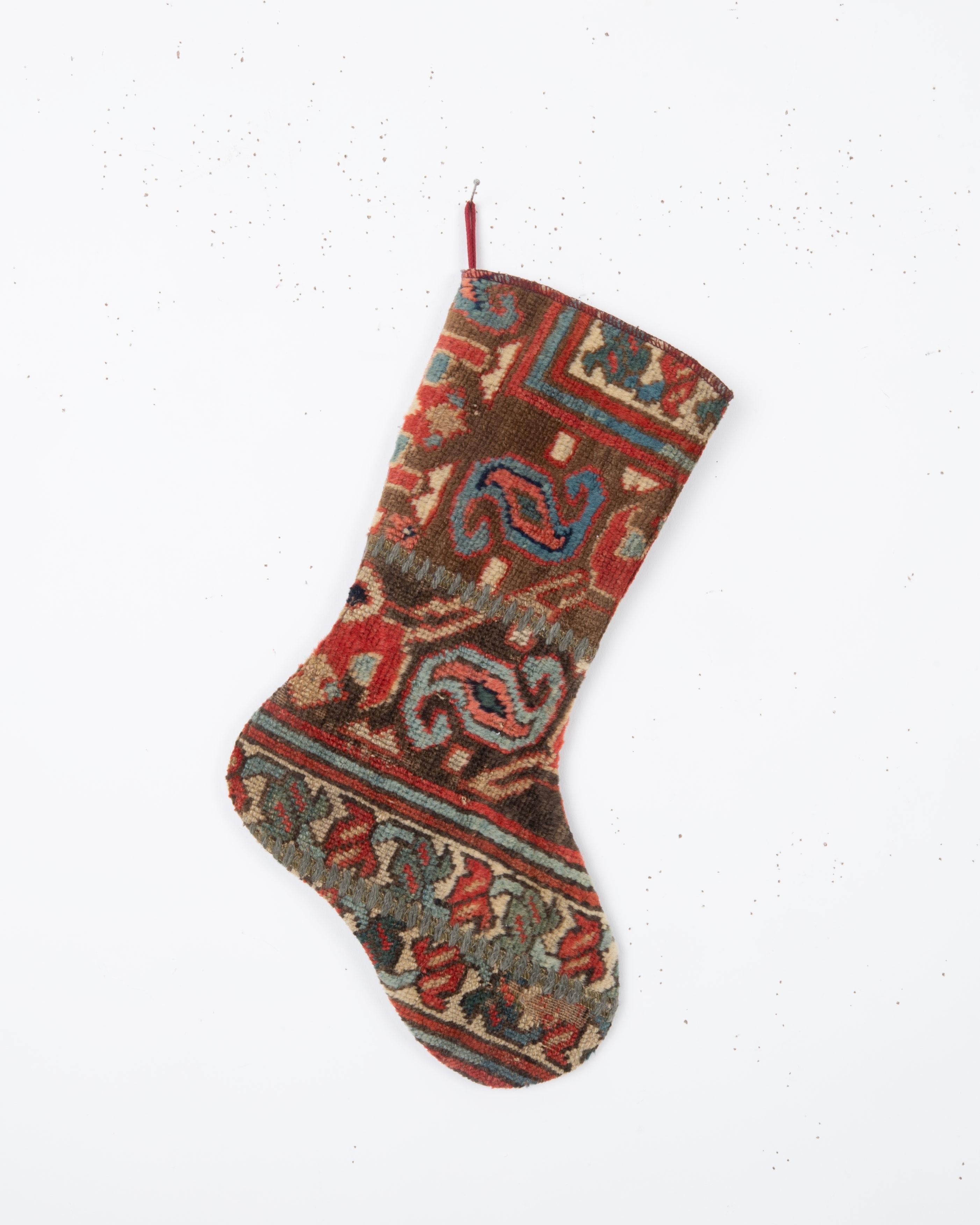 Each piece is one-of-a-kind, celebrating the artistry of traditional weaving while being repurposed into a festive and 
functional heirloom. Perfect for hanging by the fireplace, gifting, or adding a touch of vintage character to your seasonal
