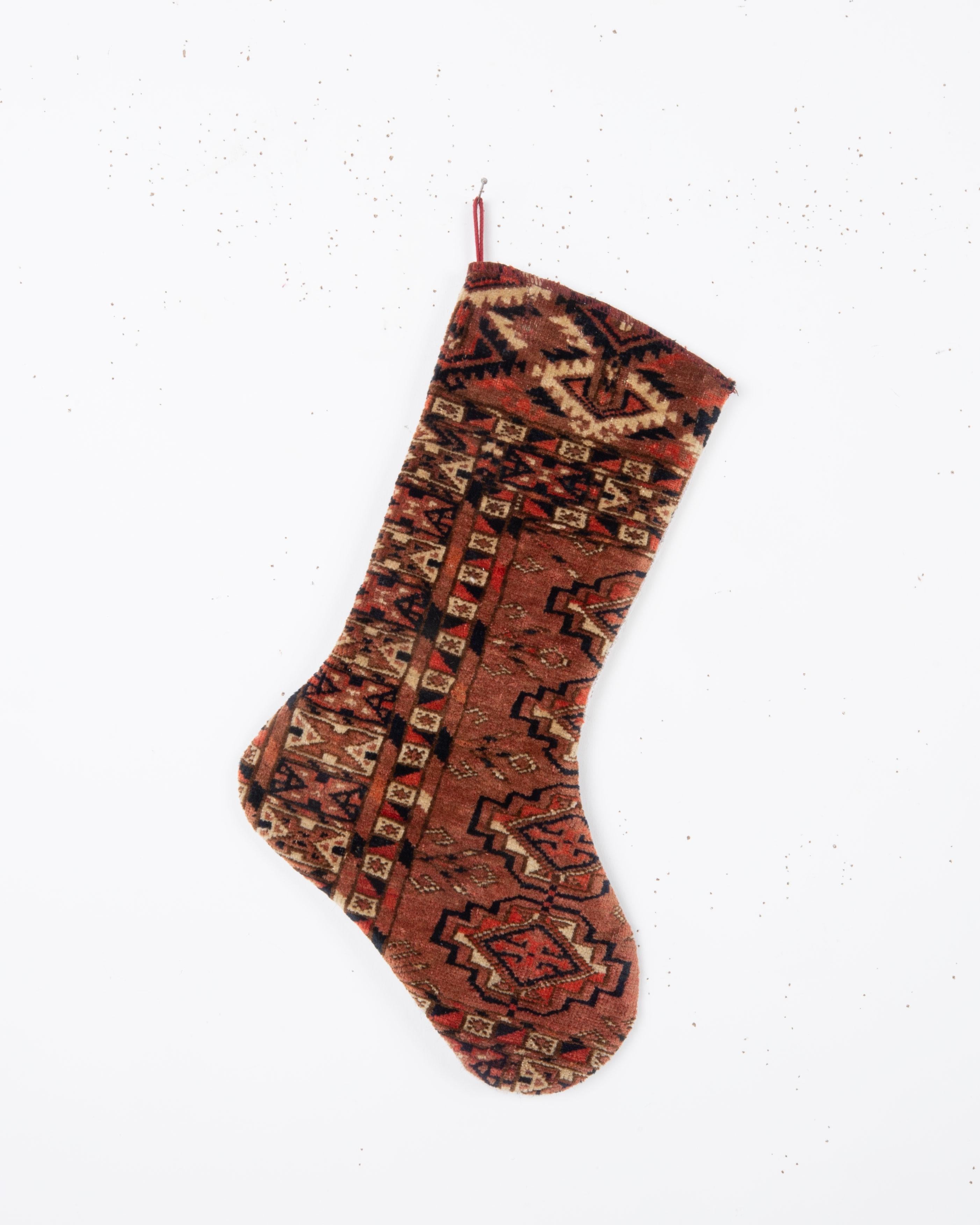 Each piece is one-of-a-kind, celebrating the artistry of traditional weaving while being repurposed into a festive and 
functional heirloom. Perfect for hanging by the fireplace, gifting, or adding a touch of vintage character to your seasonal