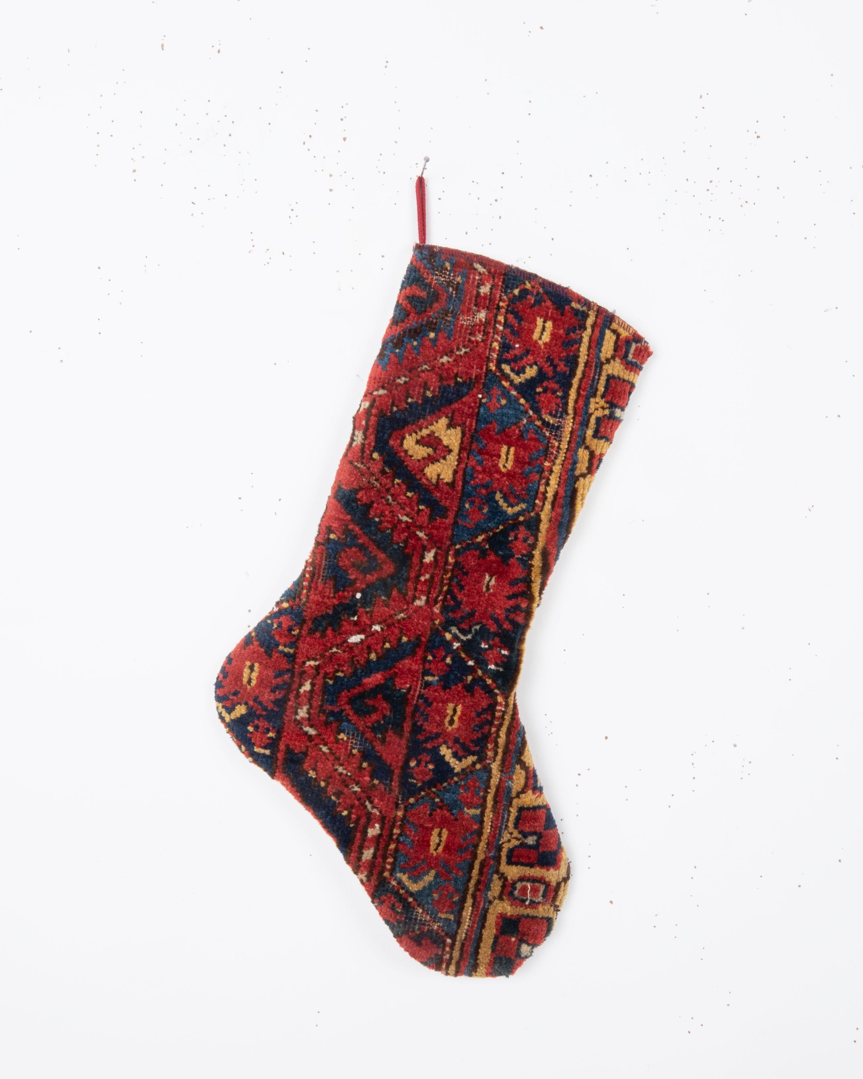Each piece is one-of-a-kind, celebrating the artistry of traditional weaving while being repurposed into a festive and 
functional heirloom. Perfect for hanging by the fireplace, gifting, or adding a touch of vintage character to your seasonal