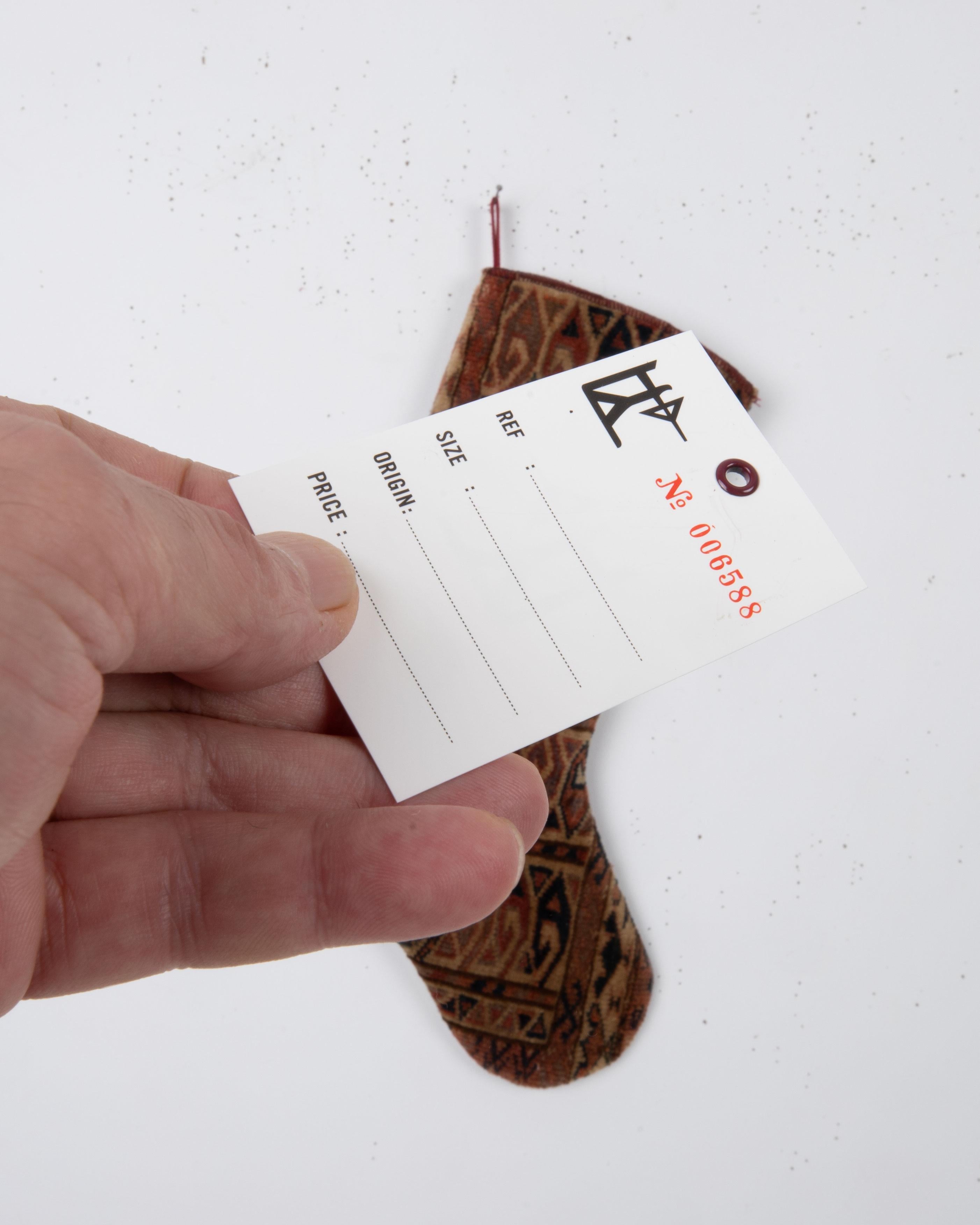 Turkmeno Antique Rug Fragment Christmas Stocking in vendita