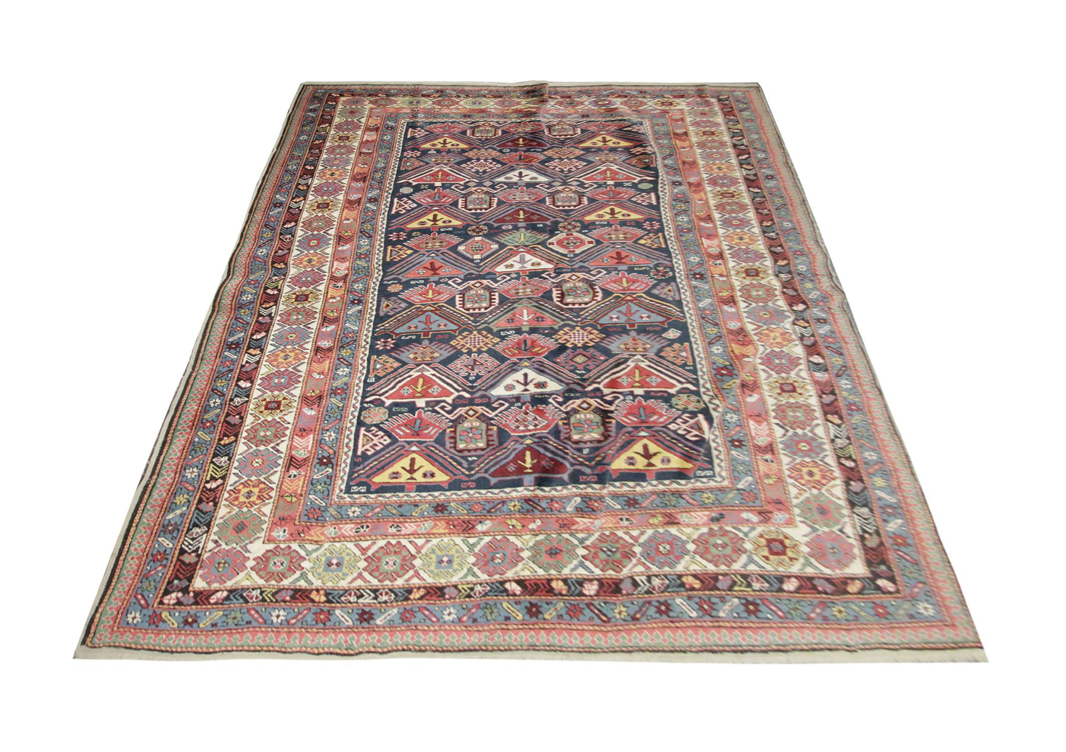 This oriental rug originates from Shirvan, Azerbaijan, it has been woven by hand with handspun wool which has been dyed with 100% organic vegetable dyes. With a multi-layered border and a symmetrical pattern, this rug will truly Stand out against