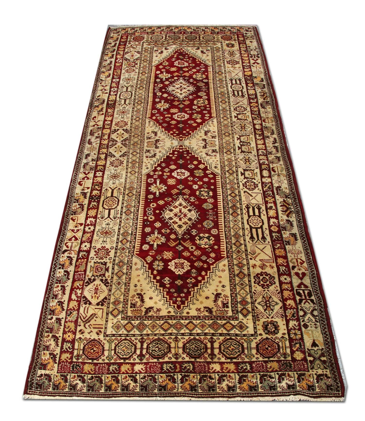 This handmade carpet oriental rug is an Indian Agra floral rug in a very good condition. The rust color on this woven rug has sat in harmony with the lime green and the gold color of the carpet. The segmented border of this carpet rug gives it the