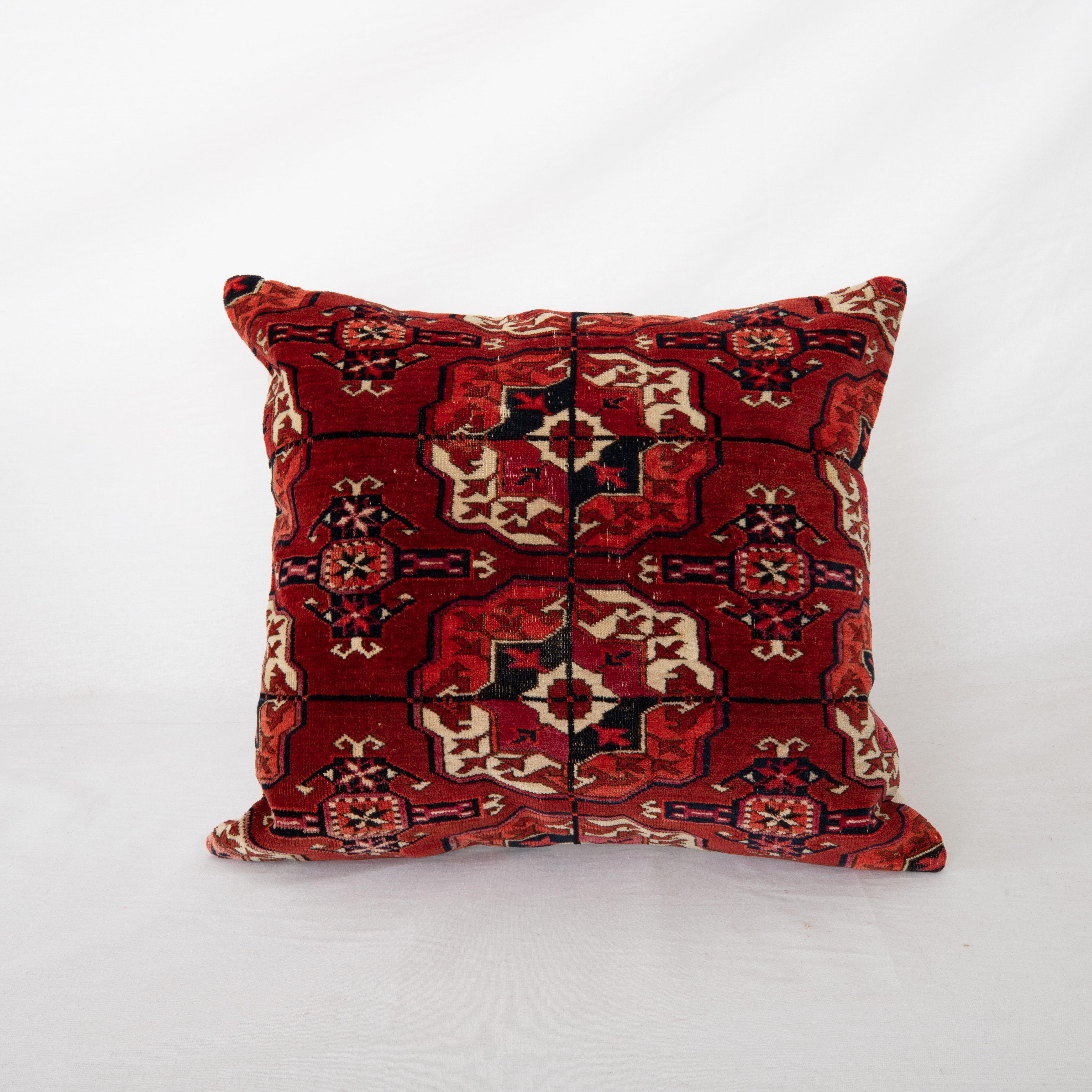 Pillowcase is made from an antique Turkmen, Tekke tribe main rug fragment dating back to 1860s.

It does not come with an insert but a bag made to size to accommodate insert materials.
Linen in the back.
Zipper closure.
Dry clean is