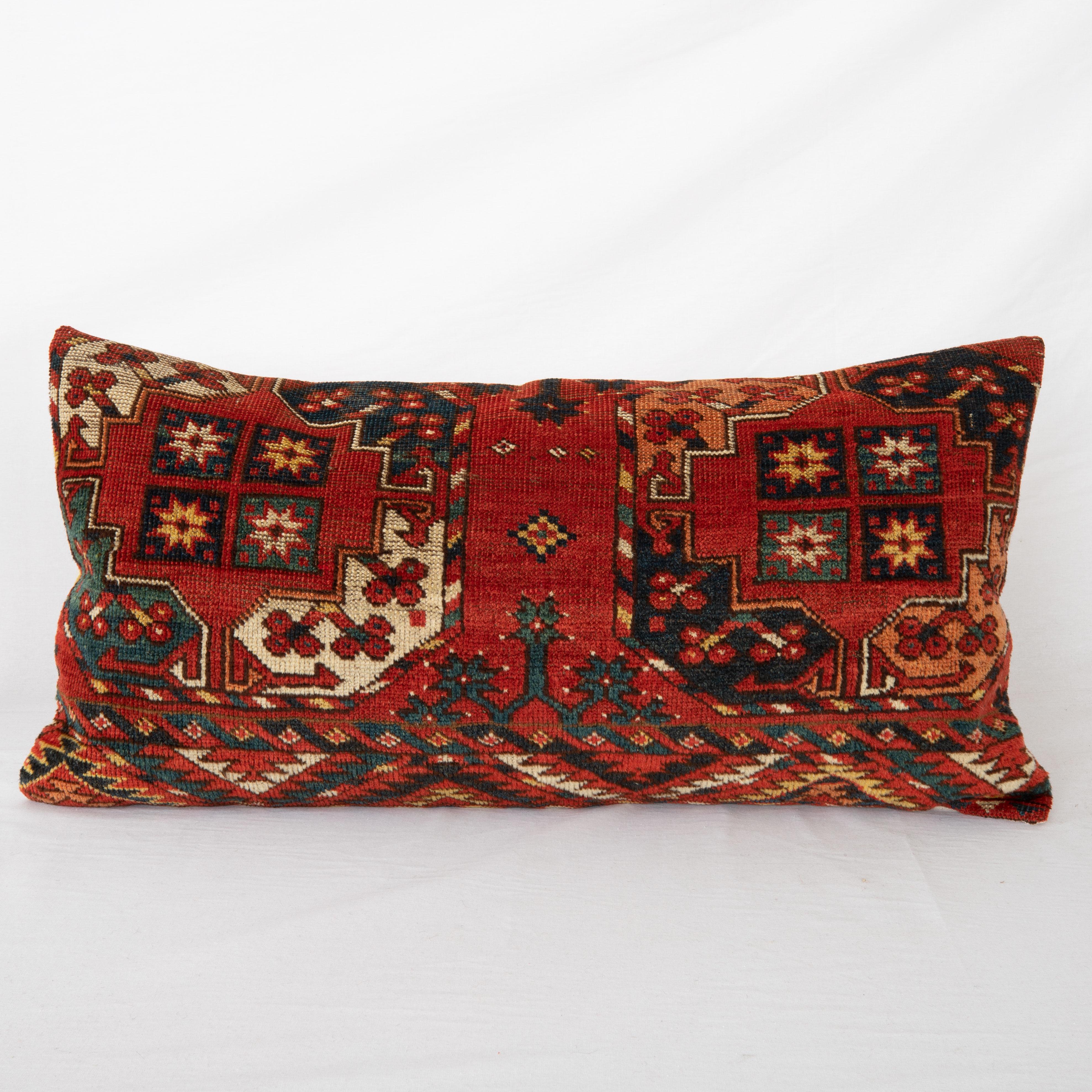Pillowcase is made from an antique Turkmen, Ersari tribe main rug fragment dating back to 1860s.

It does not come with an insert but a bag made to size to accommodate insert materials.
Linen in the back.
Zipper Closure.
Dry Clean is