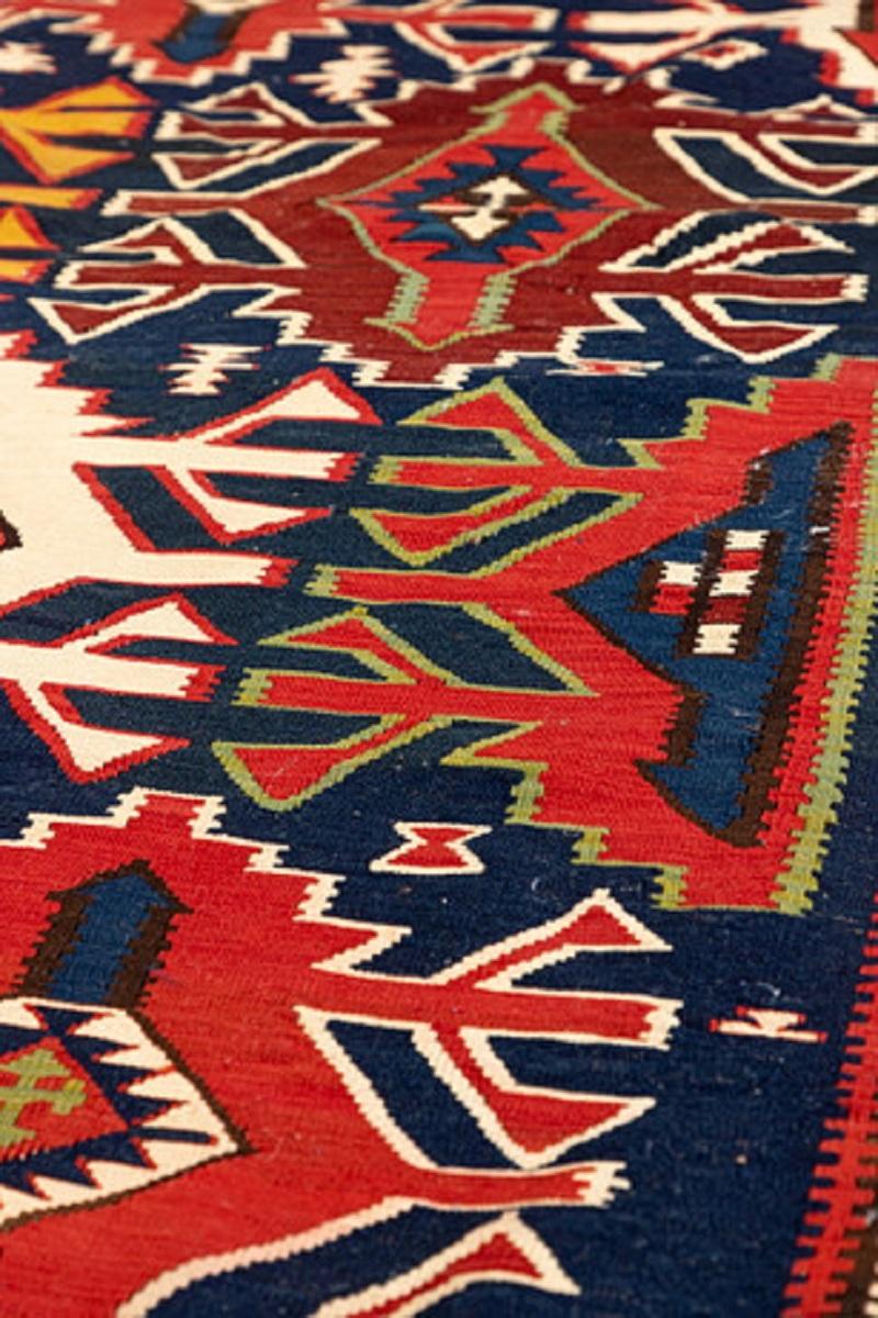 This fine decorative handmade carpet colourful rug is an Azeri carpet rug woven by very skilled weavers in Azerbaijan who used the highest quality wool on wool. The exclusive flat-weave rug has light red, orange, grey-green, white, gold, yellow and