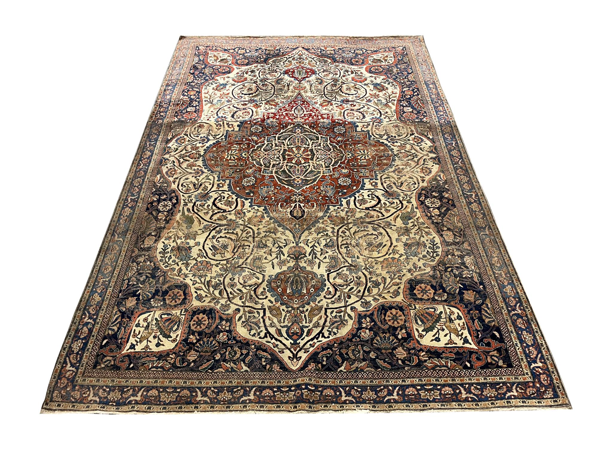 This antique area rug is a beautiful area rug woven in the late 19th century, circa 1870. There are slight signs of wear & tear in this rug, however, this only adds character to the overall aesthetic of this Kashan Mohtasham rug. It's sure to make a