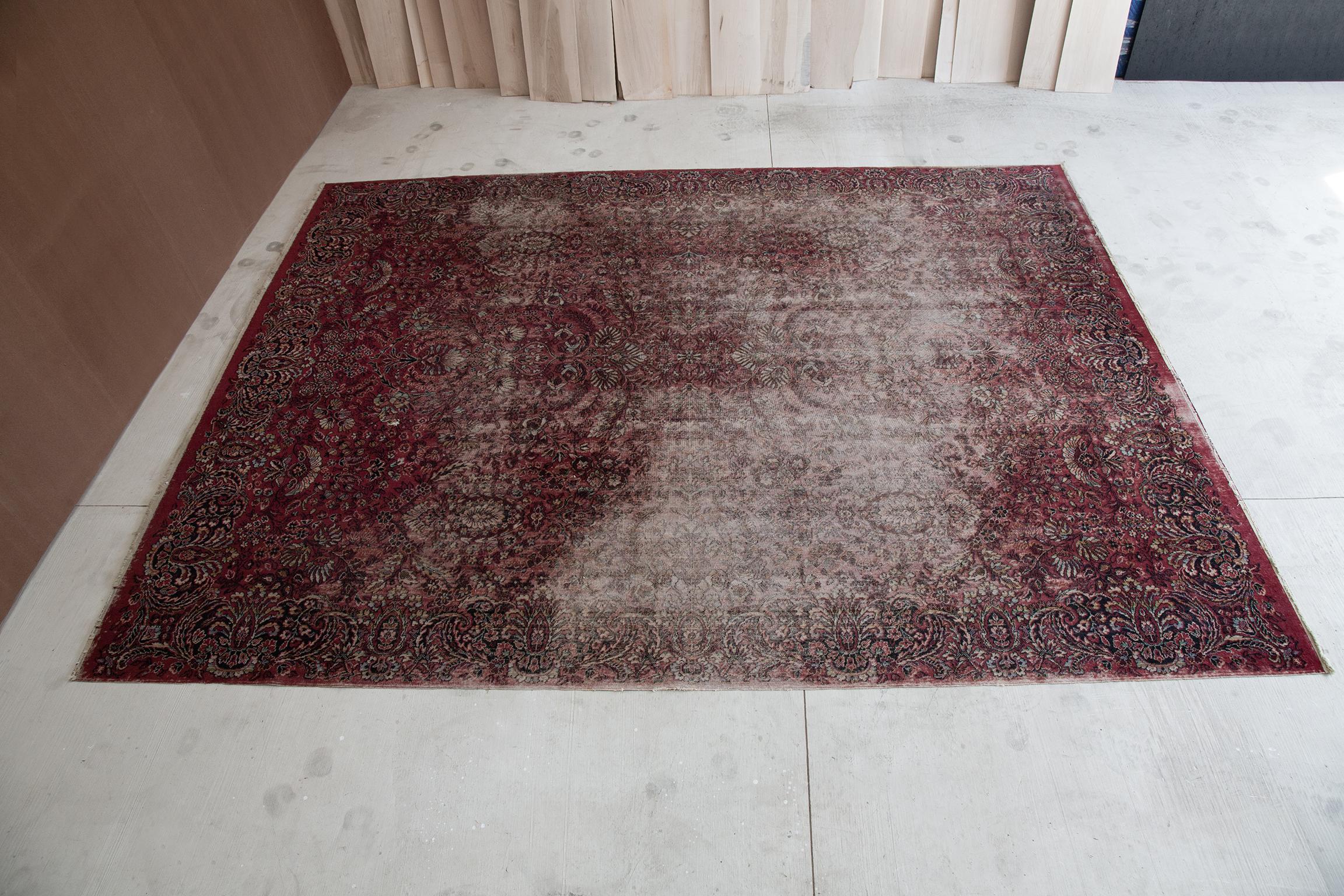 Beautifully aged and distressed antique vegetable dyed rug. There is a small hole from a sofa leg, but a local rug repair can easily mend it and make it disappear. Measures: 9x12.