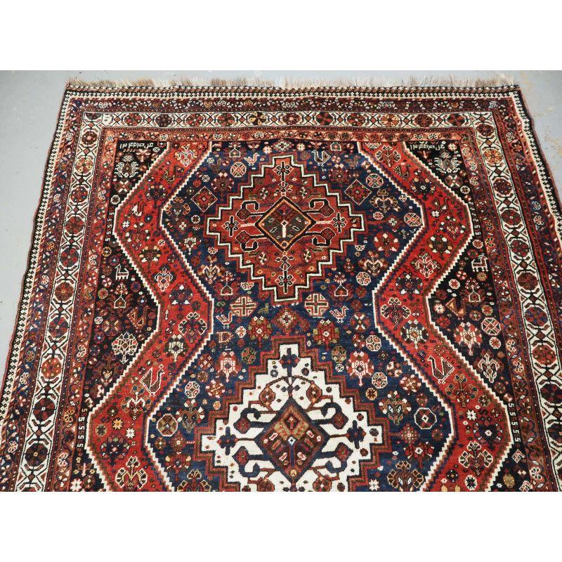 Asian Antique Rug With Tribal Design from The Shiraz Region For Sale