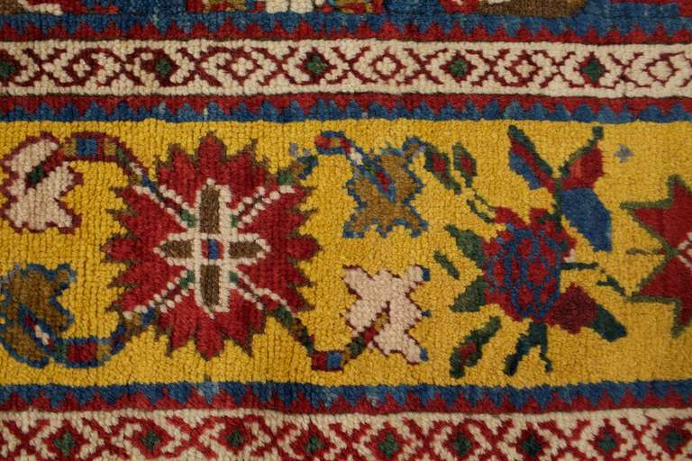 These antique rugs and runners are from the 1880s and them in excellent condition. This geometric rug has a four lozenge traditional rug designs in yellow, red, blue, green and cream. These colorful rugs would look beautifully as stair