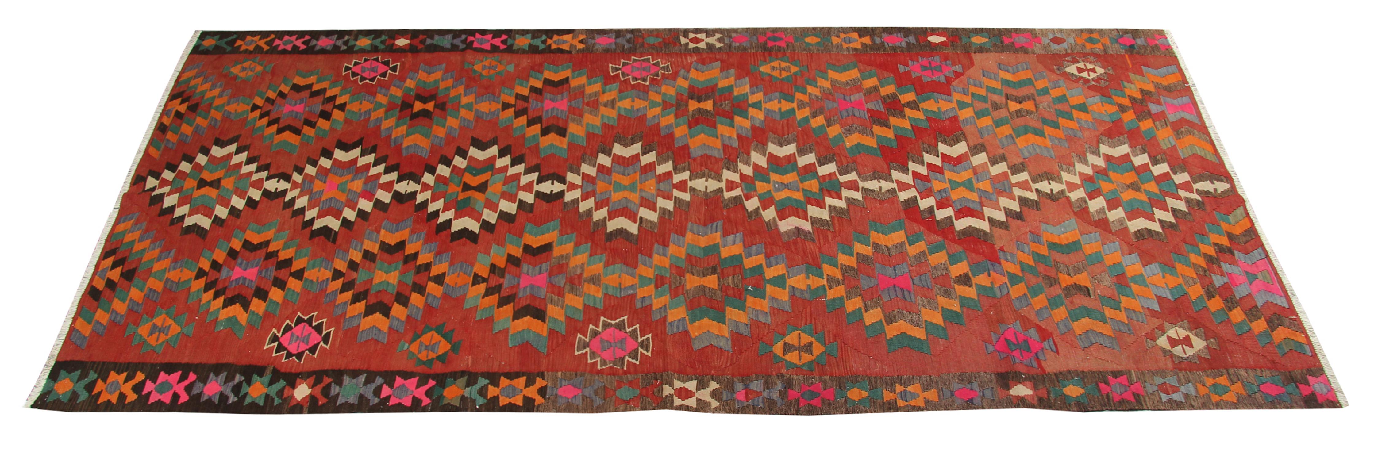 This colourful rug is a Turkish handmade carpet rug runner has woven by very skilled weavers in Turkey, who used the highest quality wool and cotton. The flat-weave rug has light red, orange, grey-green, white, gold, yellow and brown colours. The