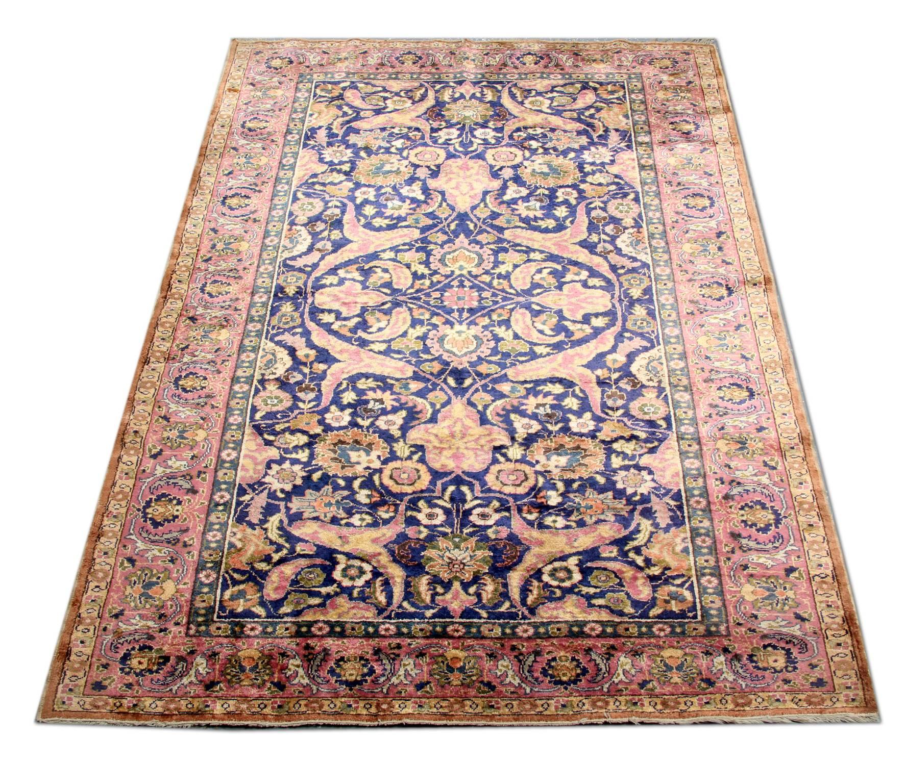 This is an example of handmade carpet finely hand knotted vintage rugs from Central Anatolia with a Classic all-over floral rug design of small patterns. The high-quality wool pile on a strong silk foundation and excellent original condition let