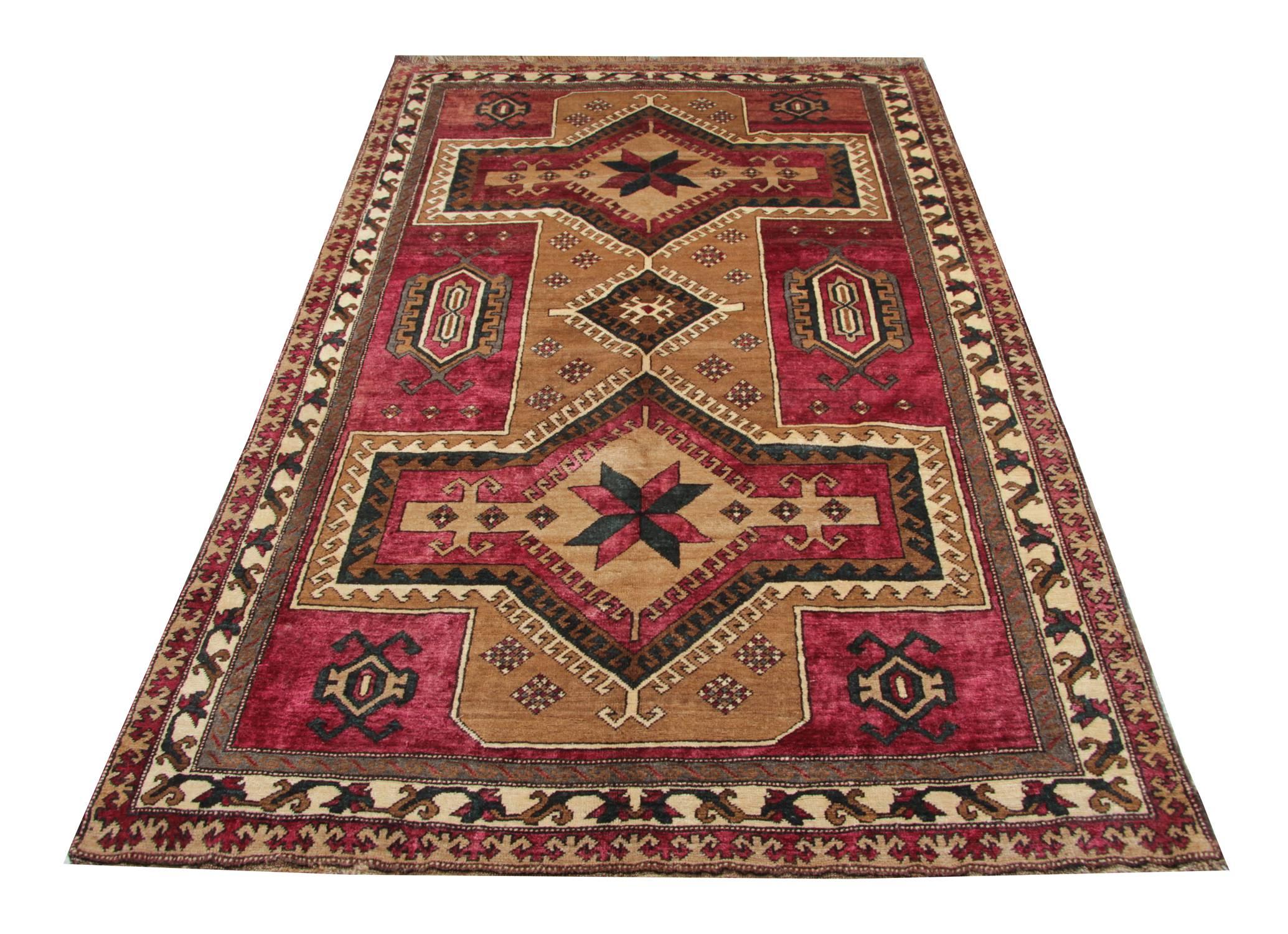 This is an antique Caucasian Karabagh geometric rug. It is a carpet rug with an excellent color combination and the contrasting gold, purple and ivory colors, look unique on this Oriental carpet. These antique rugs are back from the 1890s and could