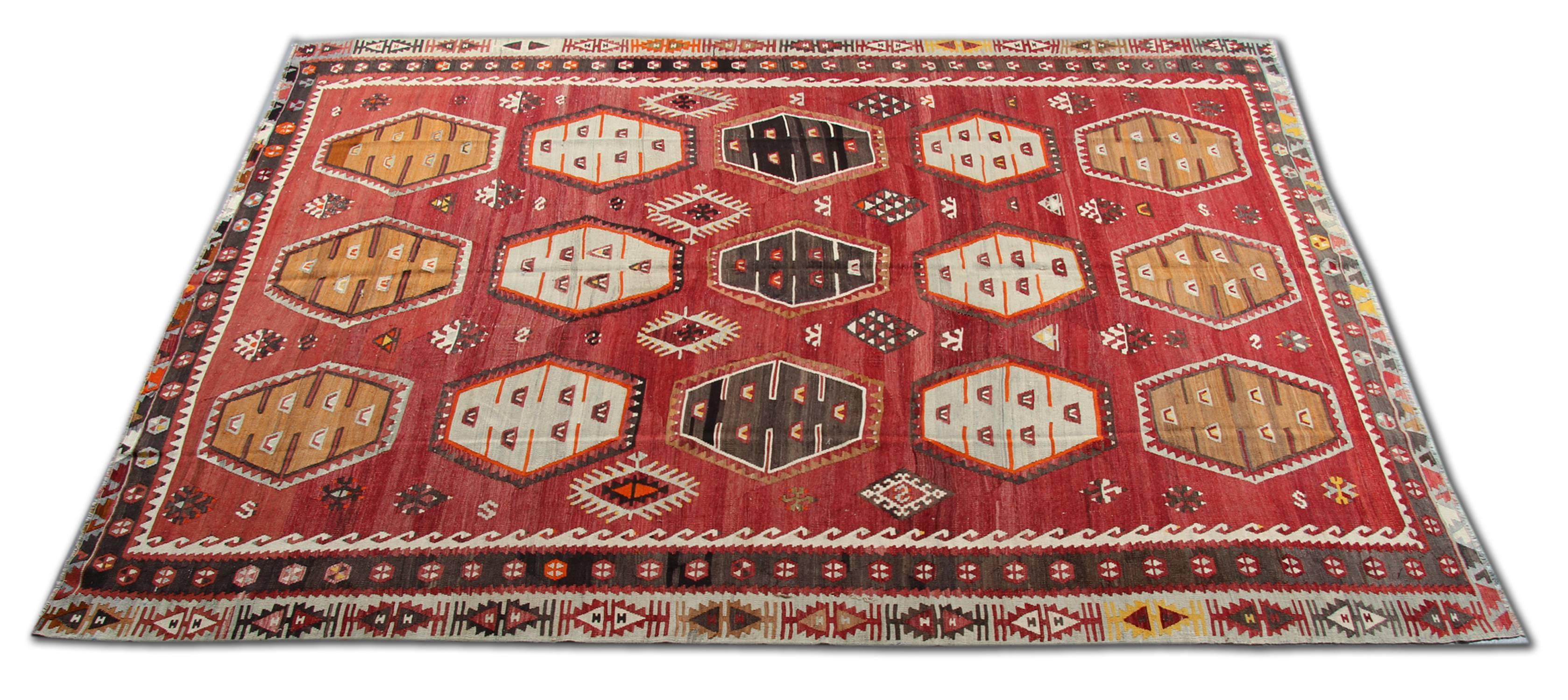 The Sarkisla red rug could enhance the decor and work as a living room or dining room rugs. The geometric floor rug and its bold design can be most appropriate for a bedroom rug. Red rugs are one of the most decorative rugs; Turkish Kilim can be an