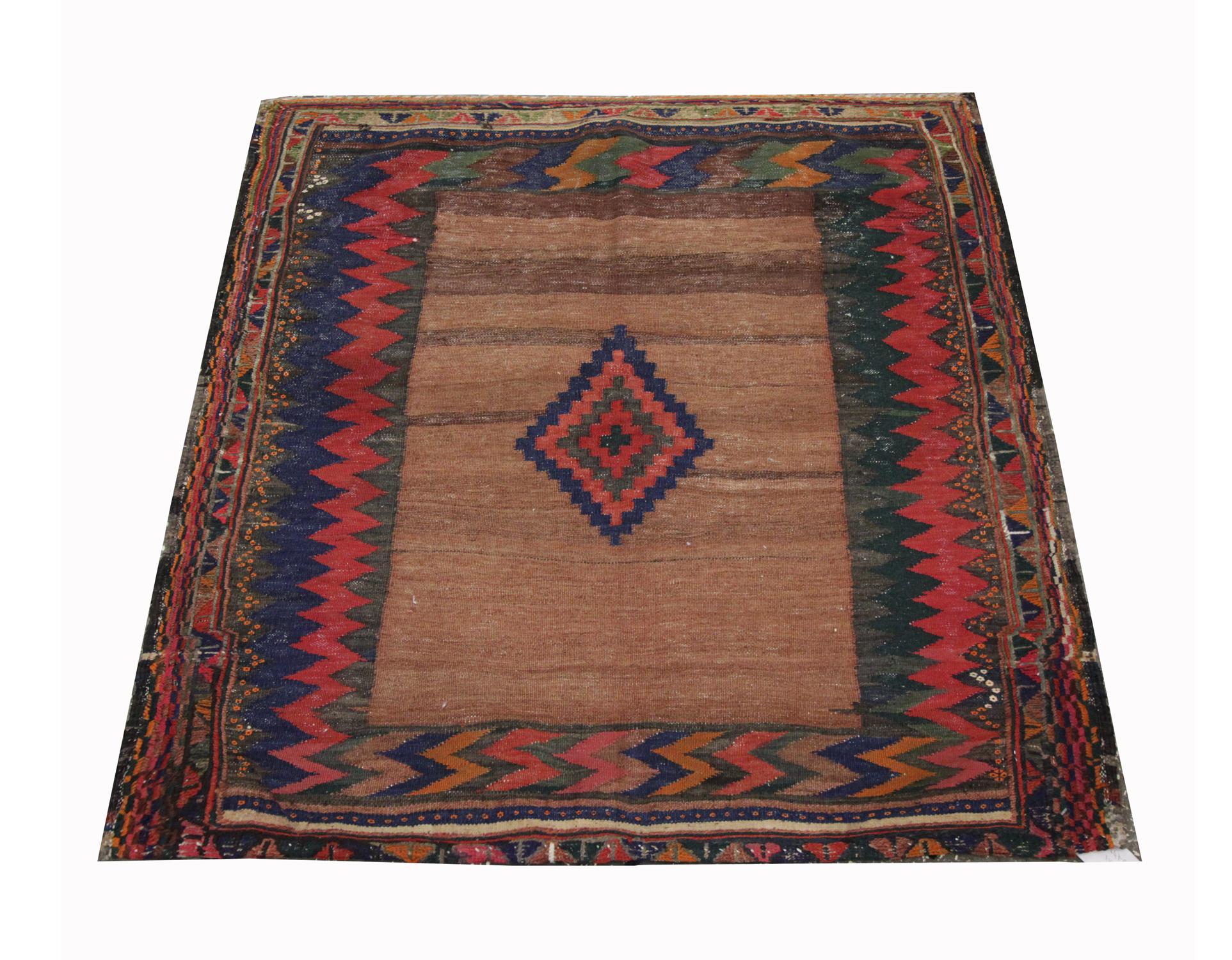 This small square handwoven rug is a traditional brown 
