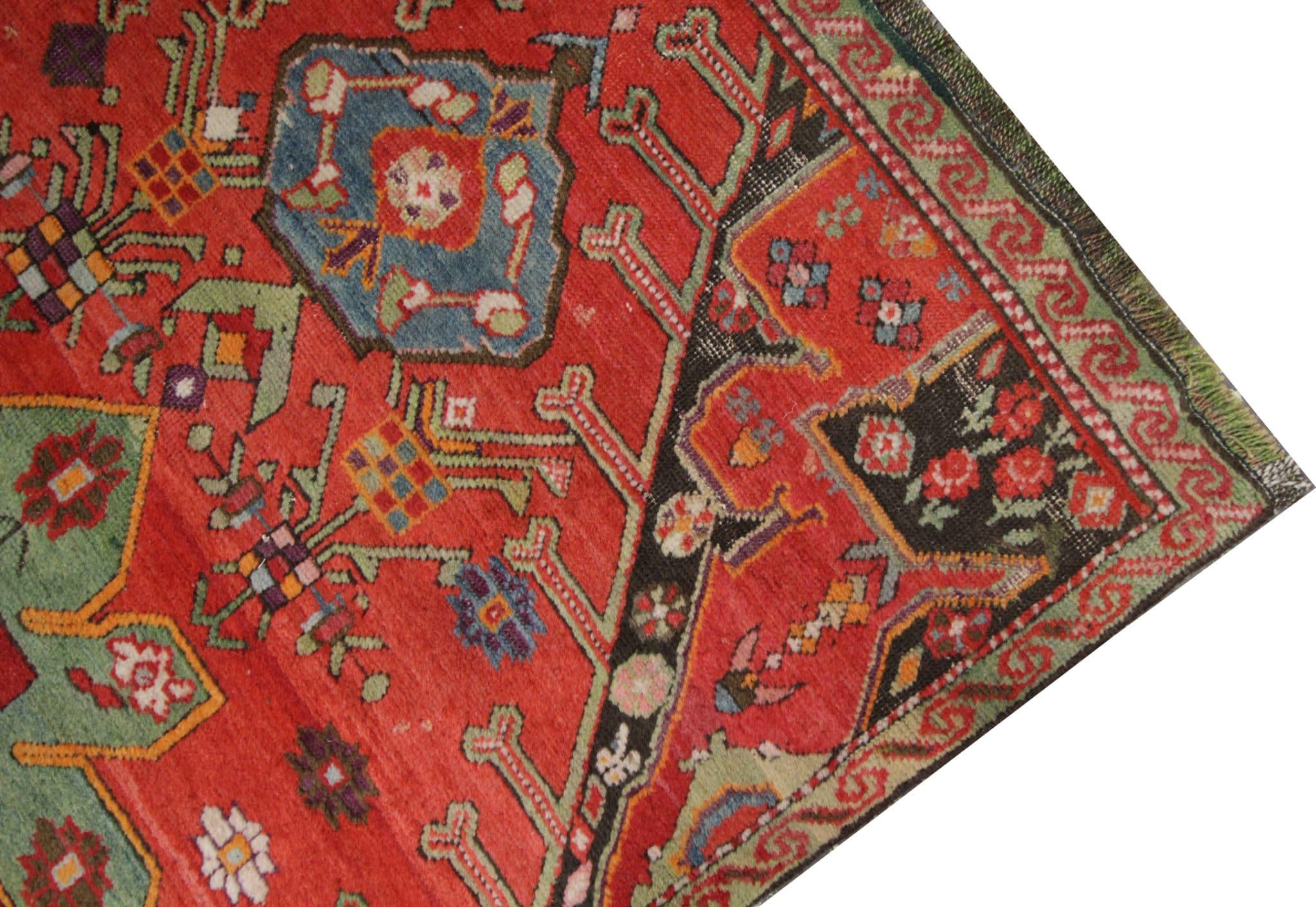 This antique runner rug originates from the Caucasus region, specifically Karabagh, Azerbaijan, dating back to the 1880s, making it a true relic of history. Hand-knotted with meticulous care, this piece boasts a traditional design with a central