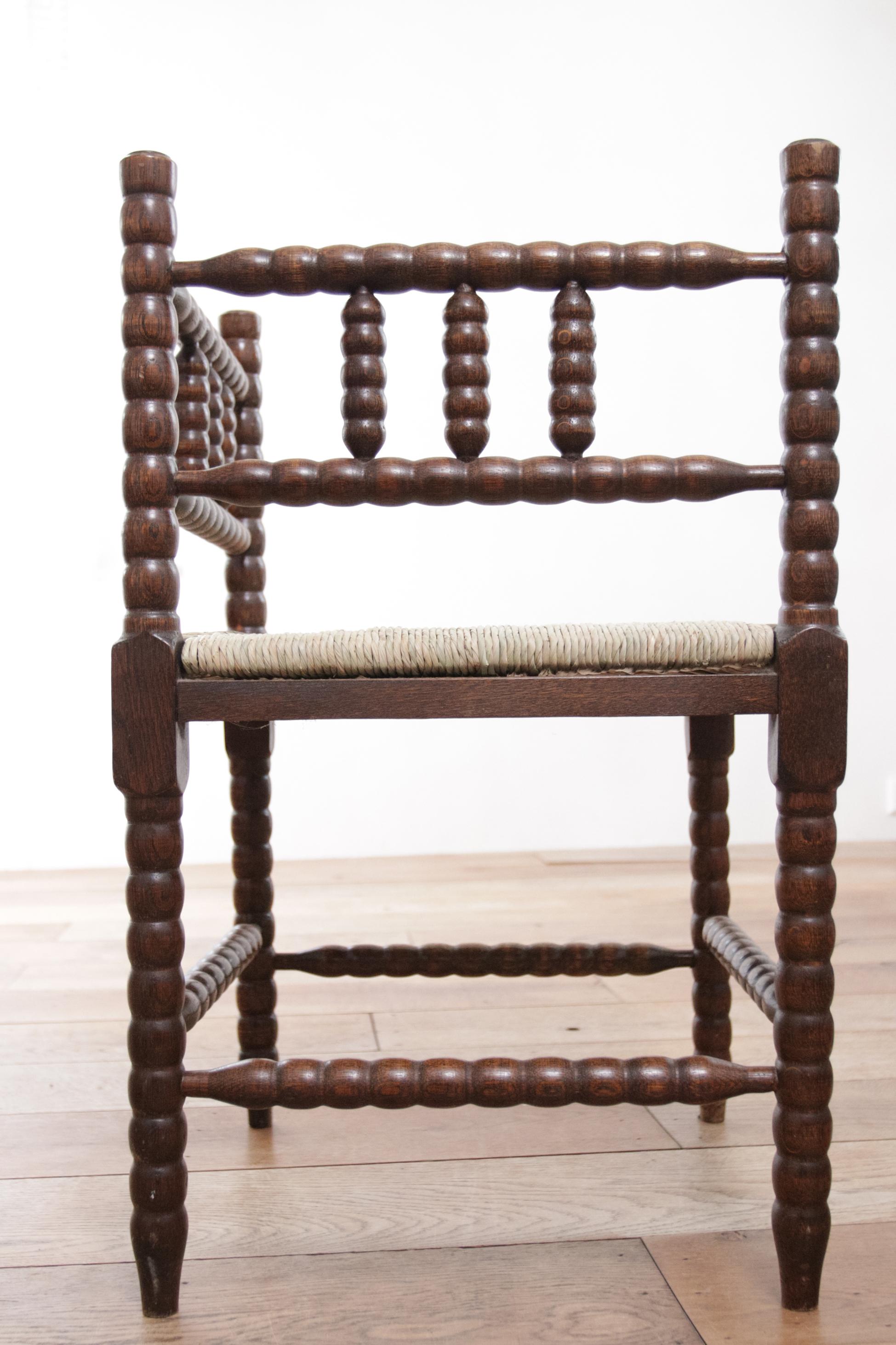 Antique Rural Dutch Carved Corner Bobbin Chair with New Rush For Sale 5