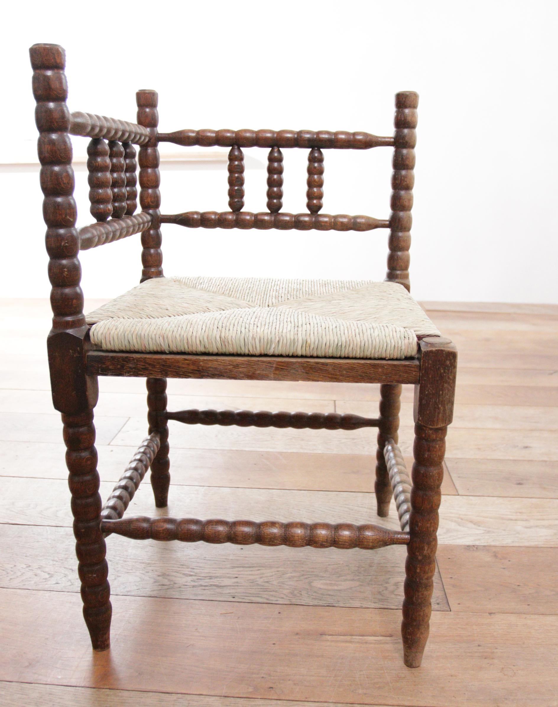 Antique Rural Dutch Carved Corner Bobbin Chair with New Rush For Sale 7