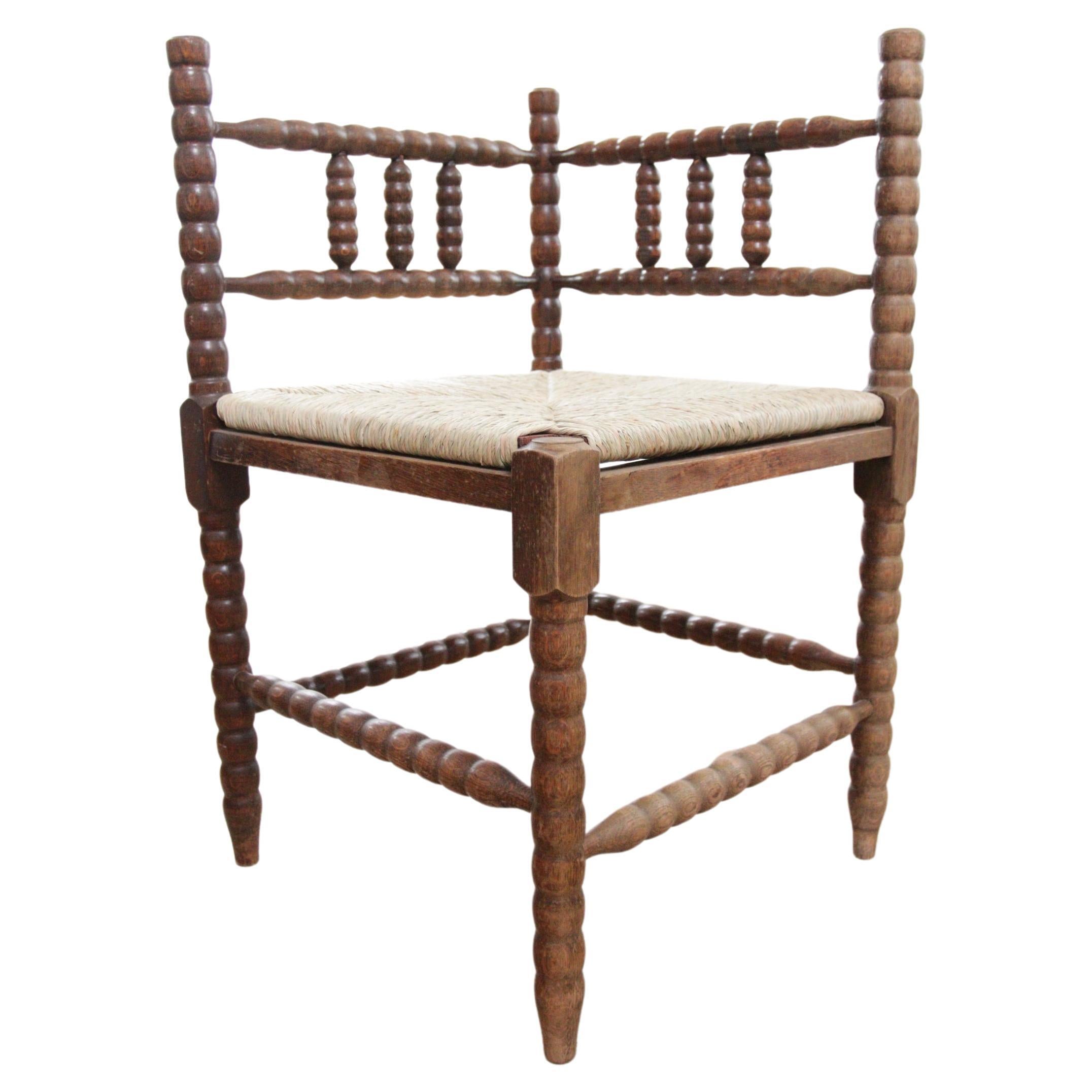 Antique Rural Dutch Carved Corner Bobbin Chair with New Rush For Sale