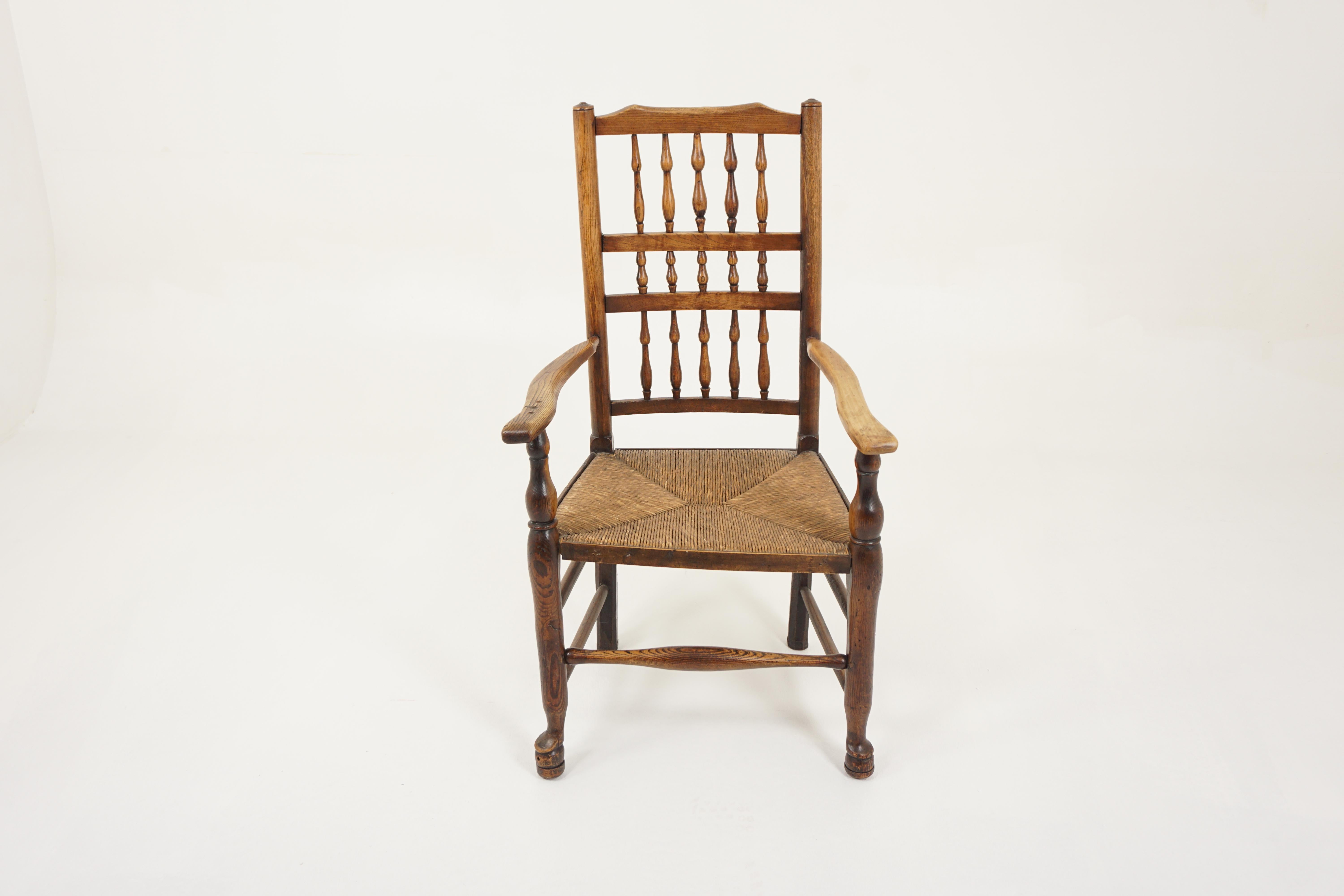 Antique Rush Seated Elm Lancashire Spindle Back Arm Chair, England 1900, H942

England 1900
Solid Elm
Original finish
Turned spindle back
Open shaped arms
Woven rush seat
On turned legs with thick shaped stretchers below
Standing on pad