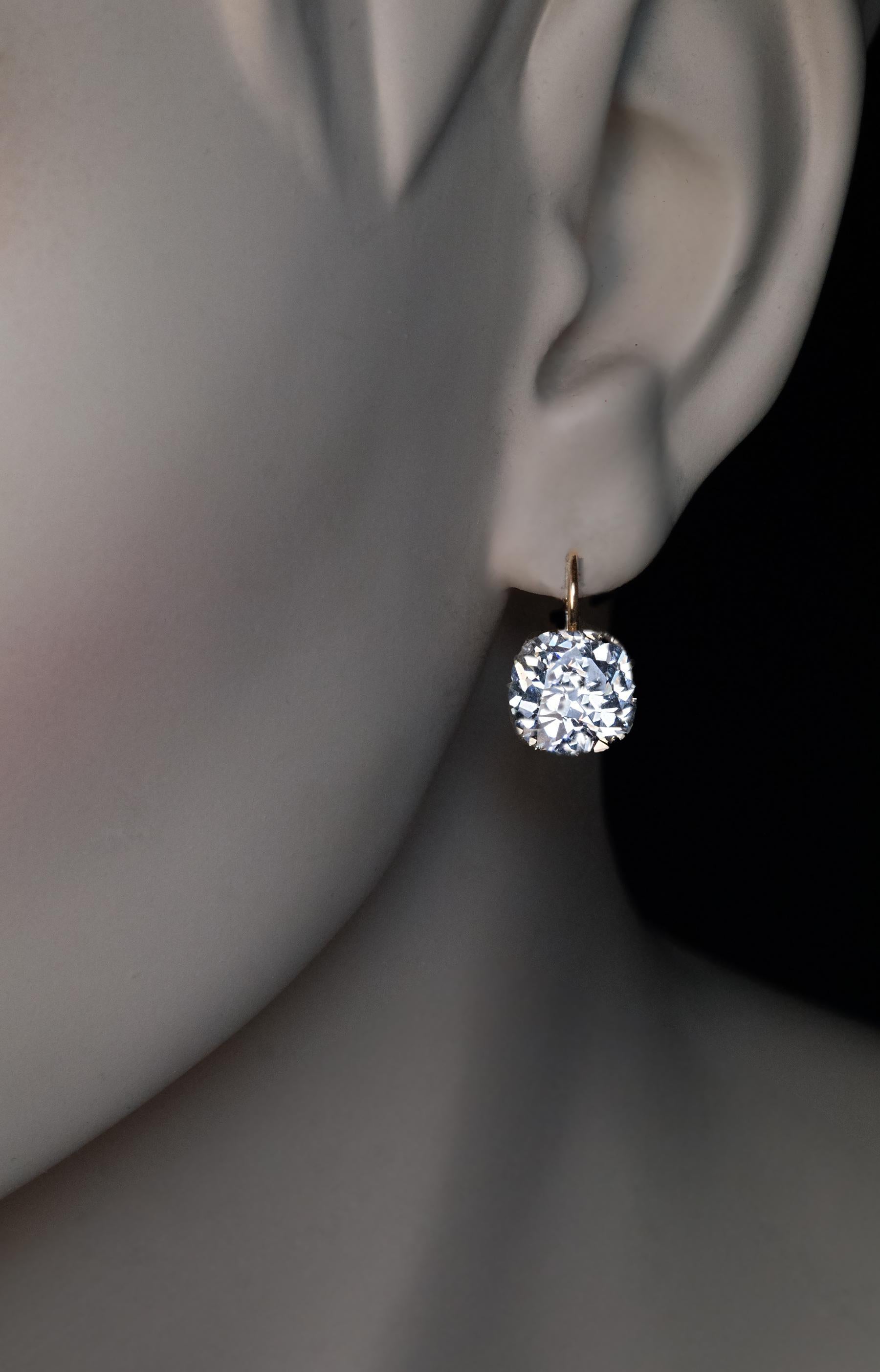 Circa 1890
These very rare antique Russian gold earrings feature two excellent old cushion cut diamonds: 2.60 cts (J color, SI1 clarity) and 2.47 cts (K color, VS2 clarity).
Total diamond weight is 5.07 carats.
Marked with 56 zolotnik old Russian