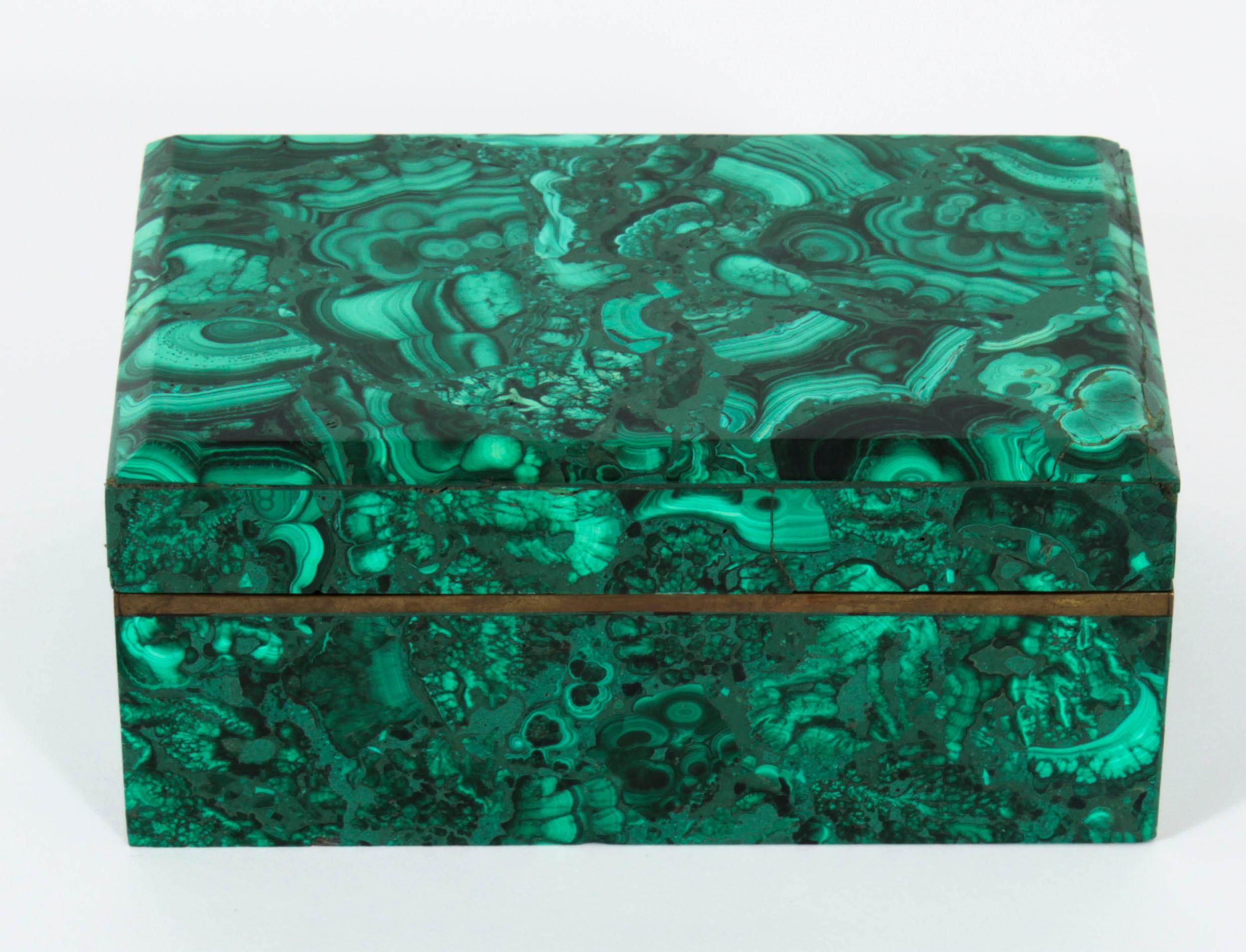 This is a superb quality antique Russian Art Deco malachite casket, Circa 1920 in date.
 
The casket with a decorative brass border below the lid.
 
Condition:
In excellent condition having been beautifully cleaned in our workshops, , please