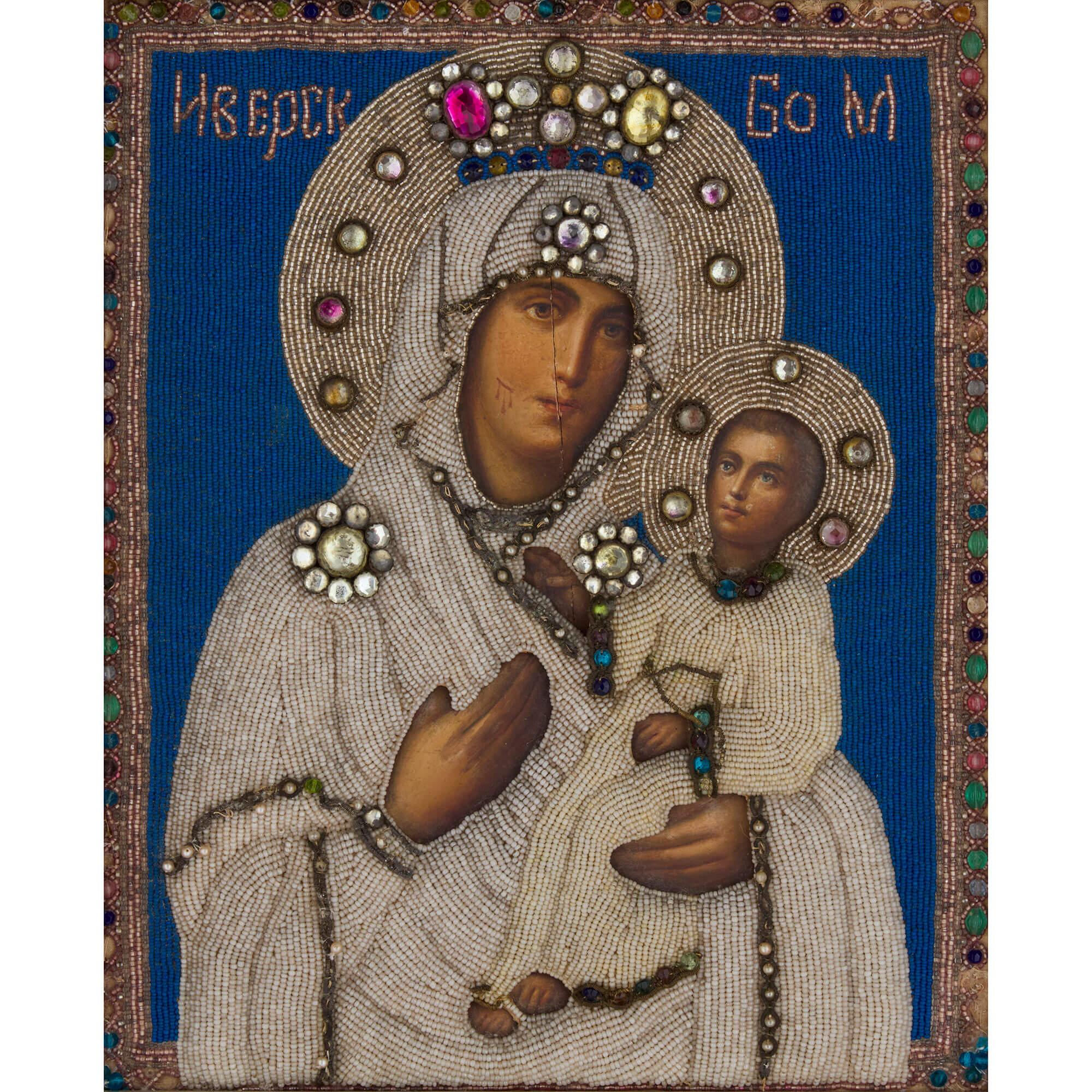 Antique Russian beaded icon after the Iverskaya
Russian, Early 20th Century
Icon: Height 34cm, width 27cm, depth 2cm
Frame: Height 48.5cm, width 42cm, depth 5.5cm

This unusual beaded religious icon is designed after the ‘Iverskaya’ (Russian) also