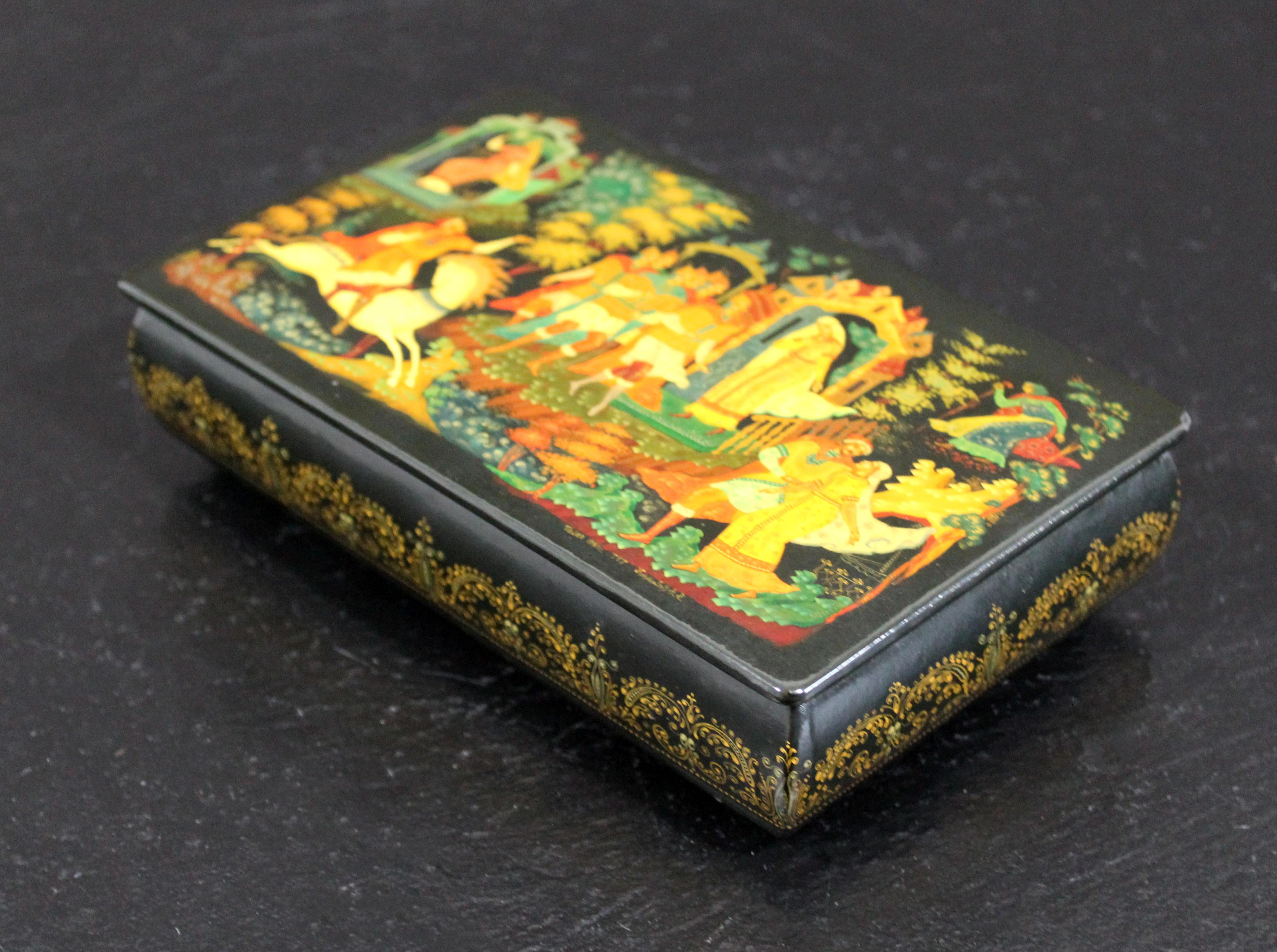For your consideration is a luxe looking, lidded, hand painted, Russian Lacquer palekh box, signed by Kornilov Alexander Albertovich. This piece offers intricate folk lore paintings. In excellent antique condition. The dimensions are 6.5