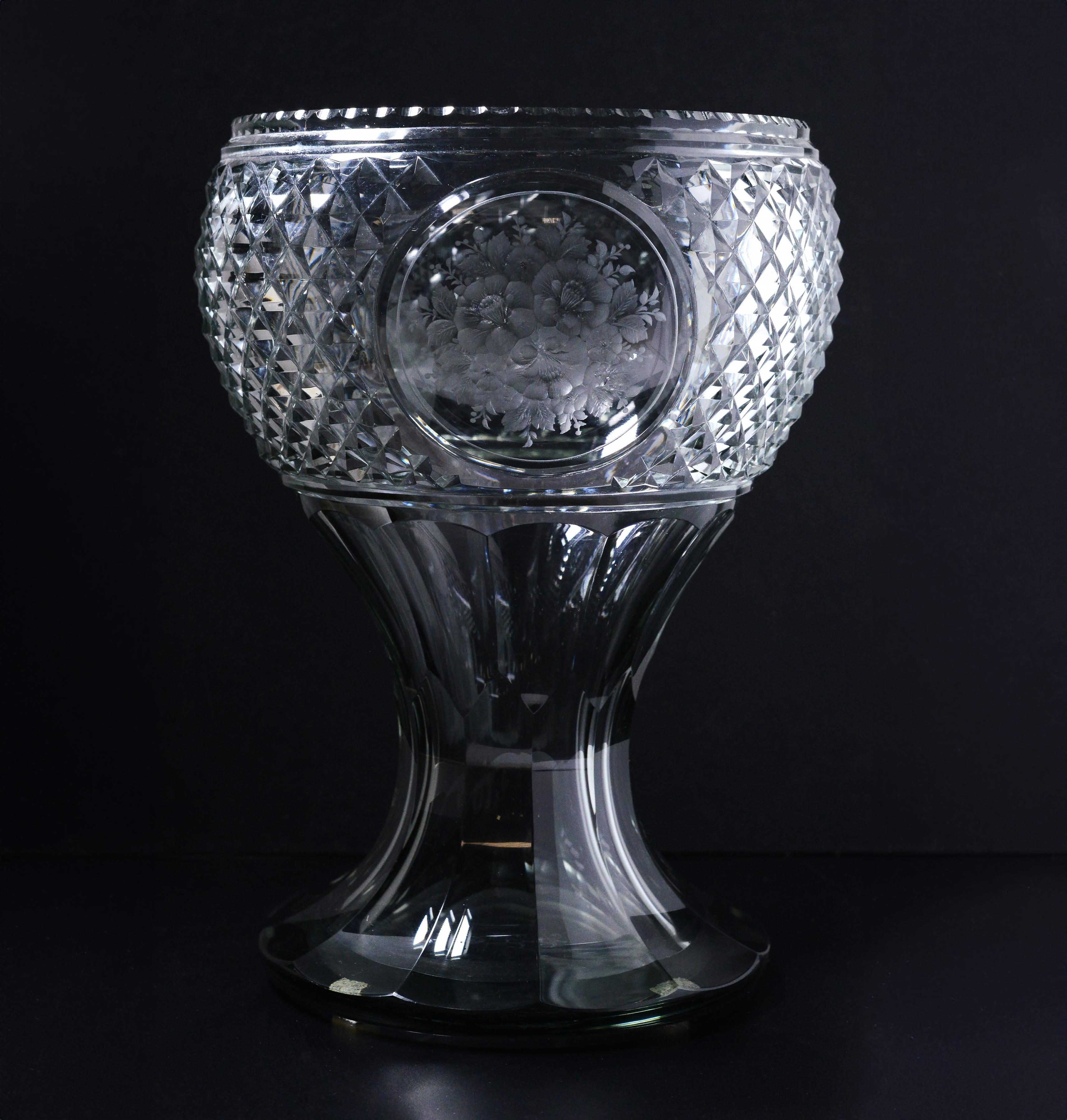 Gorgeous vase of lightly gray crystal glass, made with masterful skill by master glassblowers of past centuries, decorated with 3 round medallions of various garden flowers. Signed at bottom 