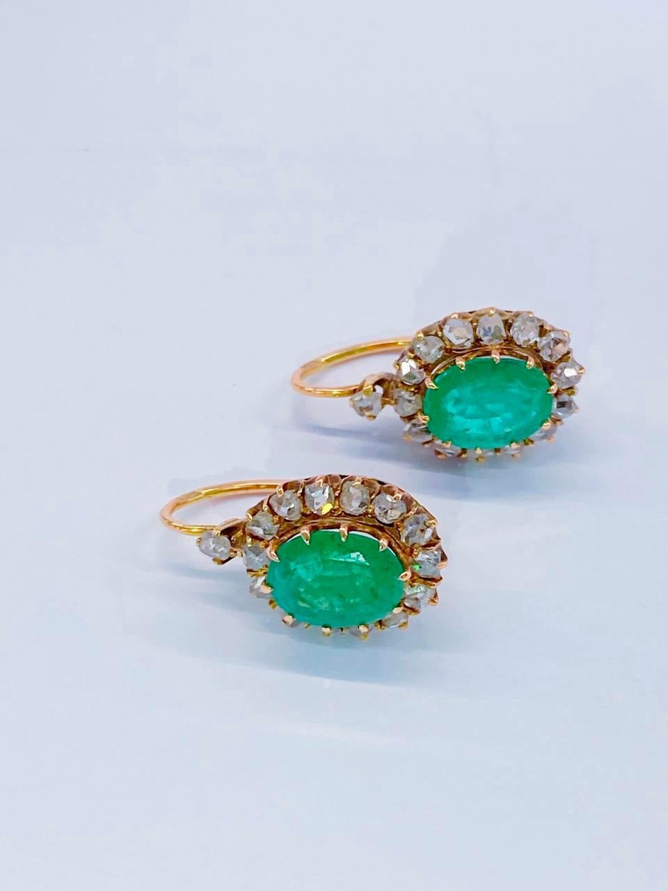 Antique Russian emerald earrings centered with natural oval cut green emerald with a diameter of 9mm×7mm estimate weight 4 carats flanked with rose cut diamonds total earrings length 2cm hall marked 56 imperial Russian gold standard and st