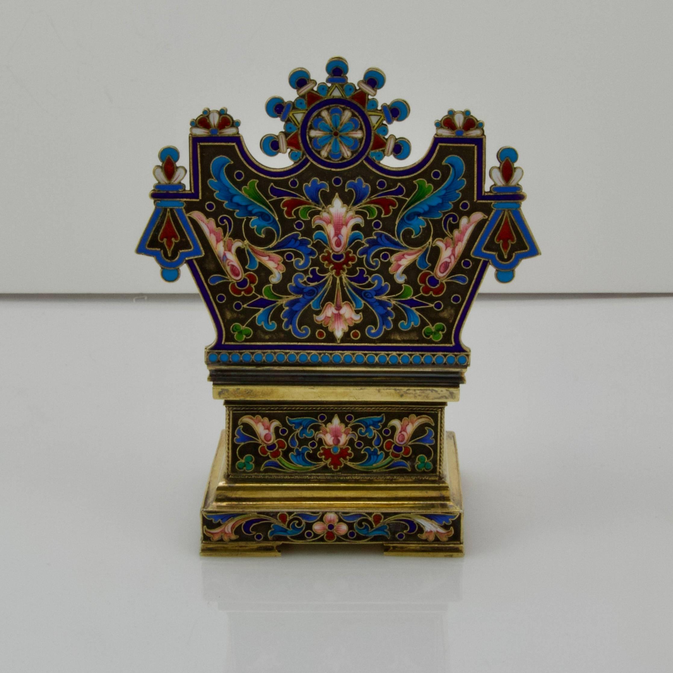 Large vermeil salt-chair overall enameled on a black ground.
Antique traces of inscription removed in the lid. 
Imperial mark.
Mark and signature of Pavel Ovchinikov
Mark of Moscow 1896-1908
Weight 327 g
Measure: Height 13.8 cm.
 