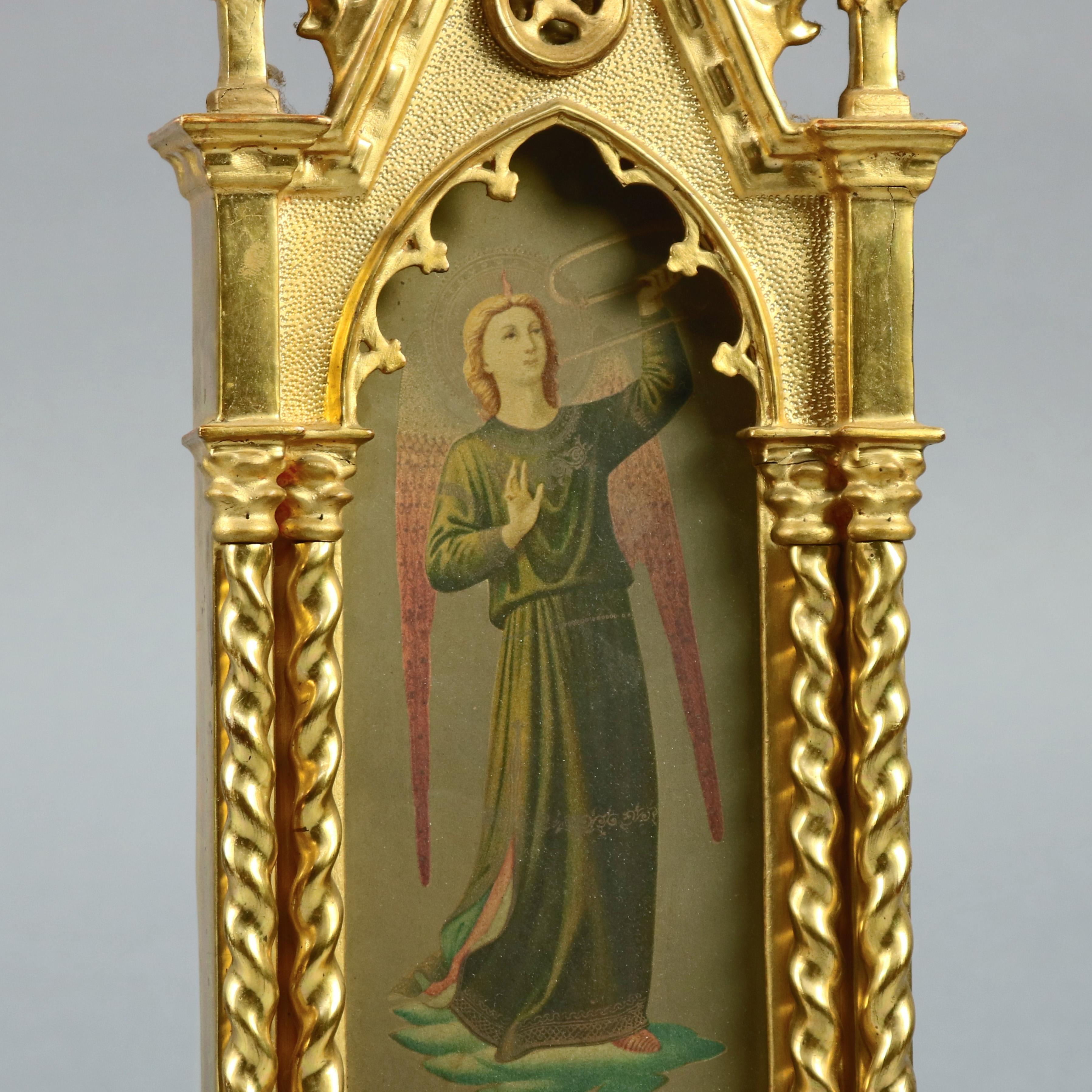 An antique Russian Icon offes ornate giltwood cathedral form and footed frame housing full length portrait of winged saints, circa 1890

Measures: 19